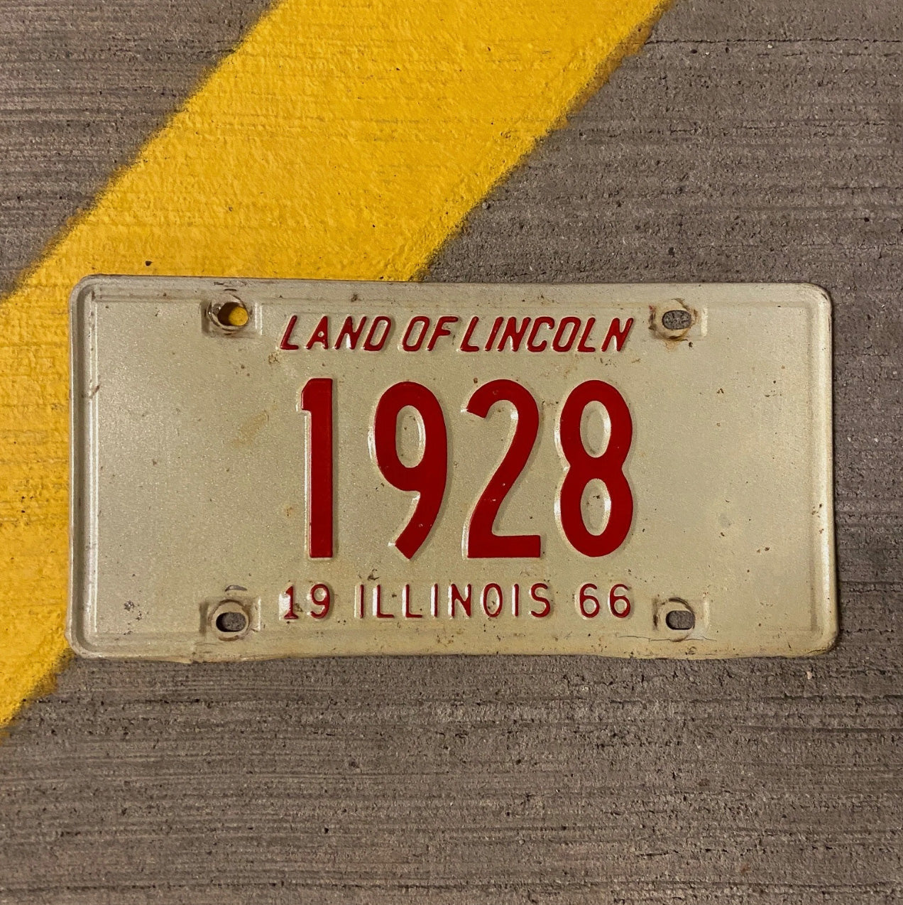 Photo of a 1966 Illinois License Plate Auto Tag Garage Decor Vintage Low Number Four Digit 1928 with original patina