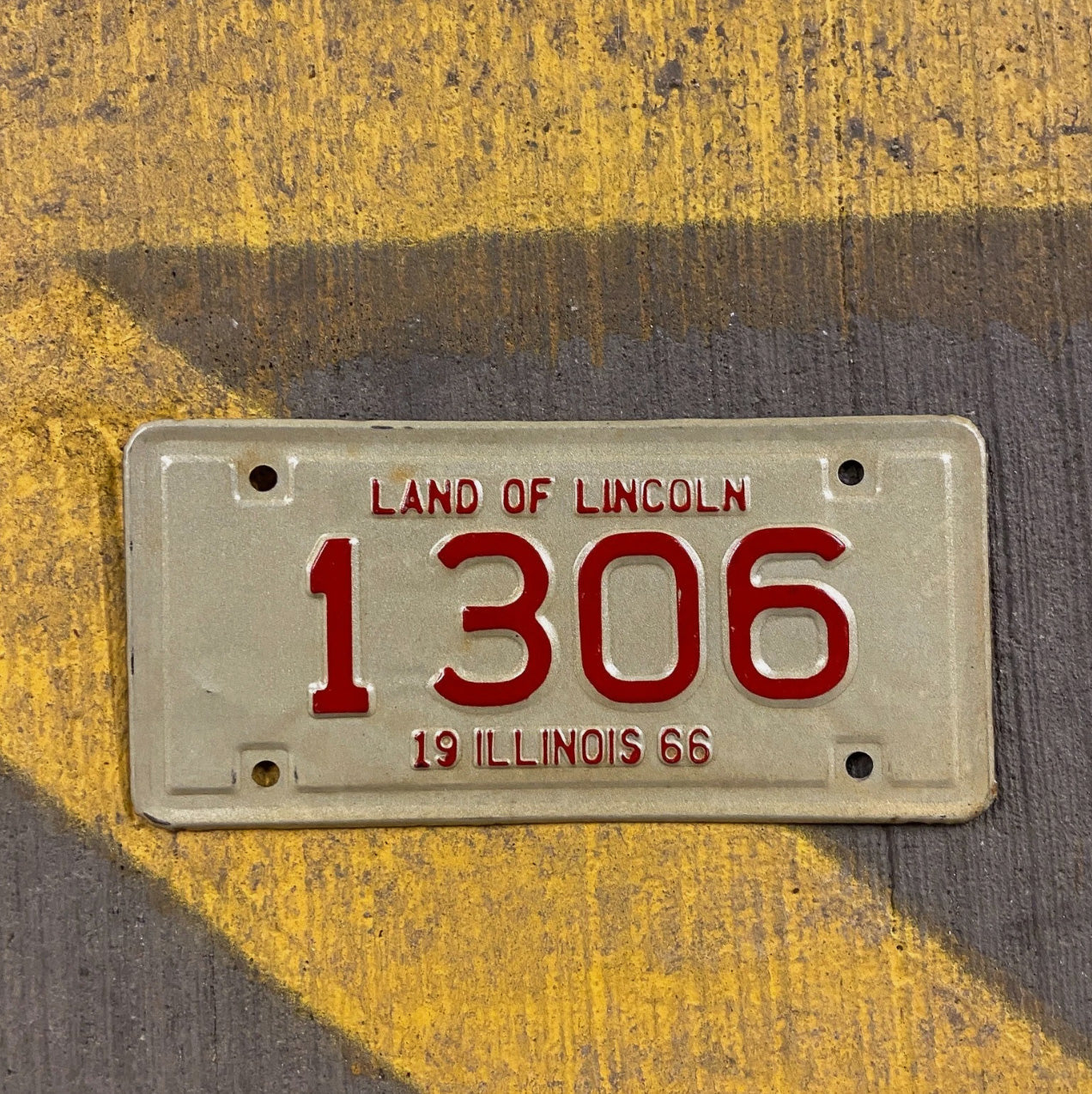 Photo of a 1966 Illinois Motorcycle License Plate Auto Tag Garage Decor Vintage Low Number Four Digit 1306 with original patina