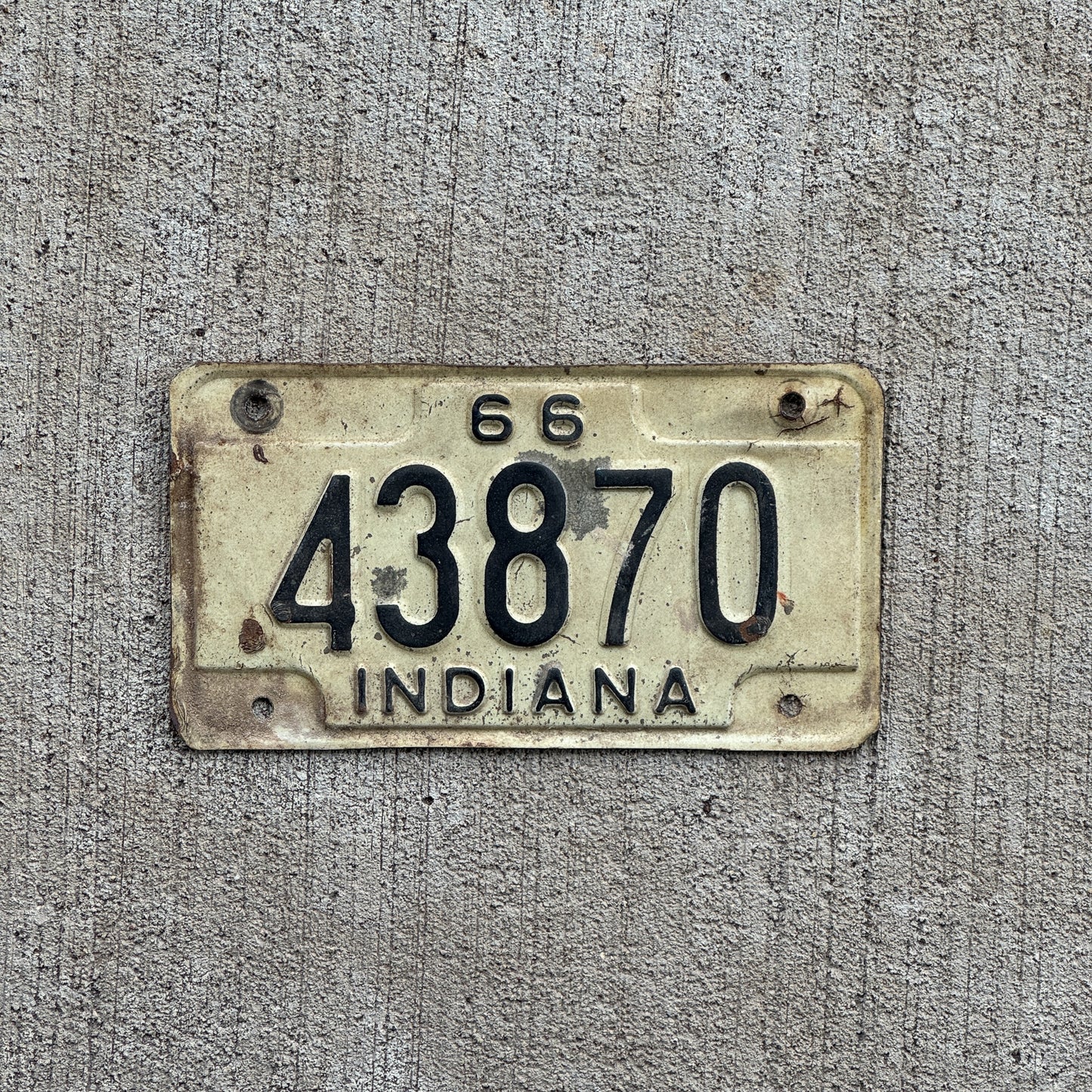 Photo of a 1966 Indiana Motorcycle License Plate Auto Tag Garage Decor Vintage 43870 with original patina