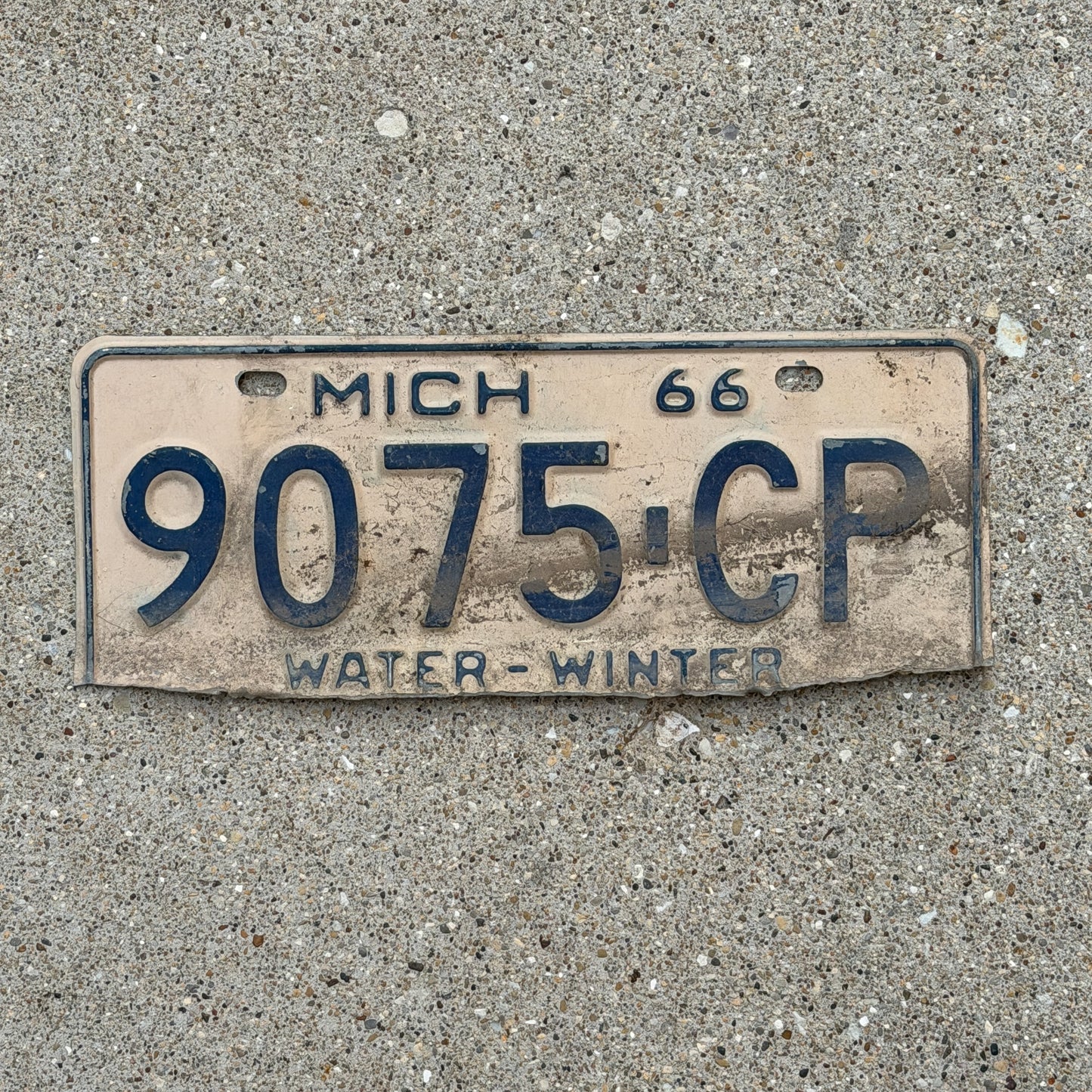 Photo of a 1966 Michigan Commercial License Plate Auto Tag Garage Decor Vintage 9075 CP with original patina