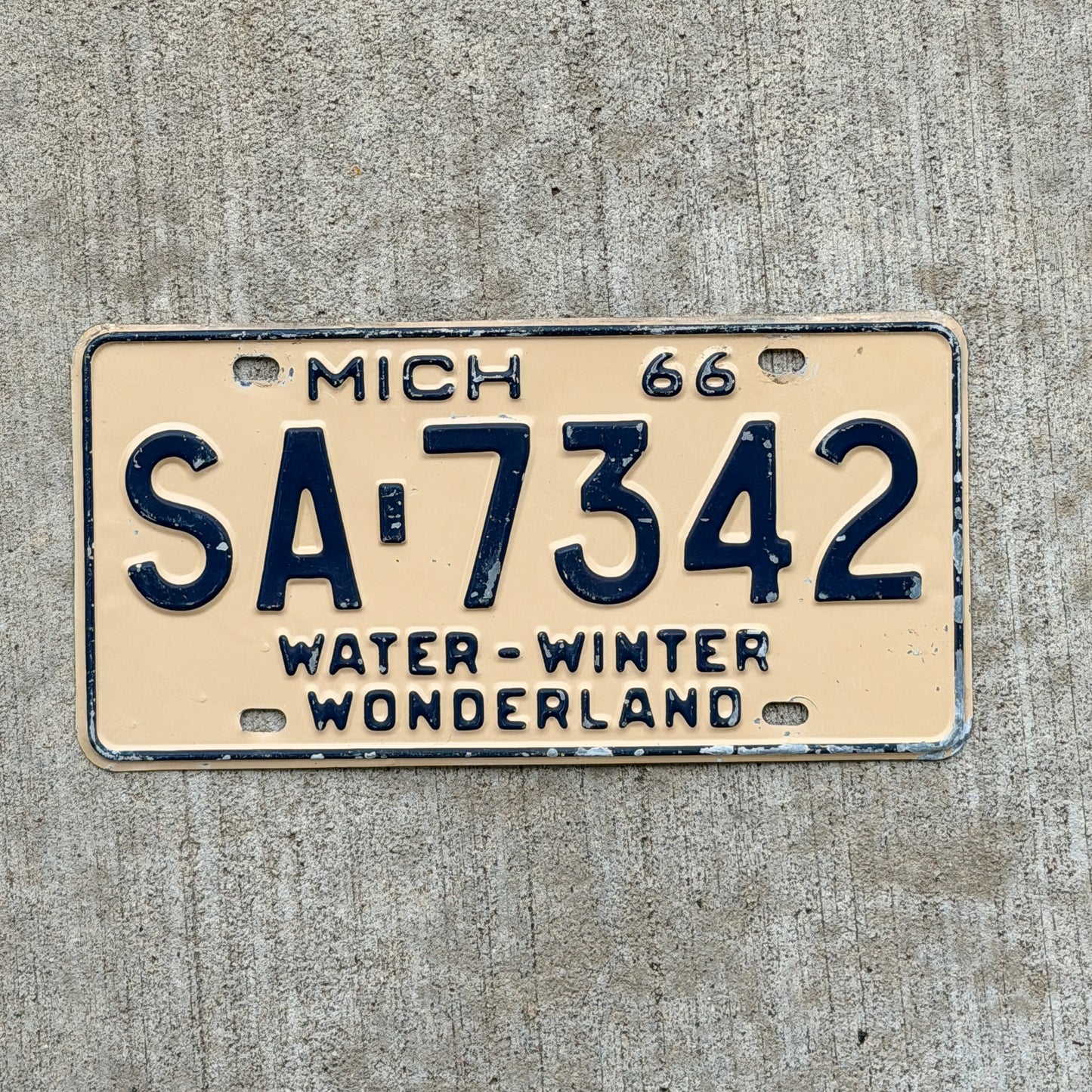 Photo of a 1966 Michigan License Plate Auto Tag Garage Decor Vintage SA 7342 with original patina