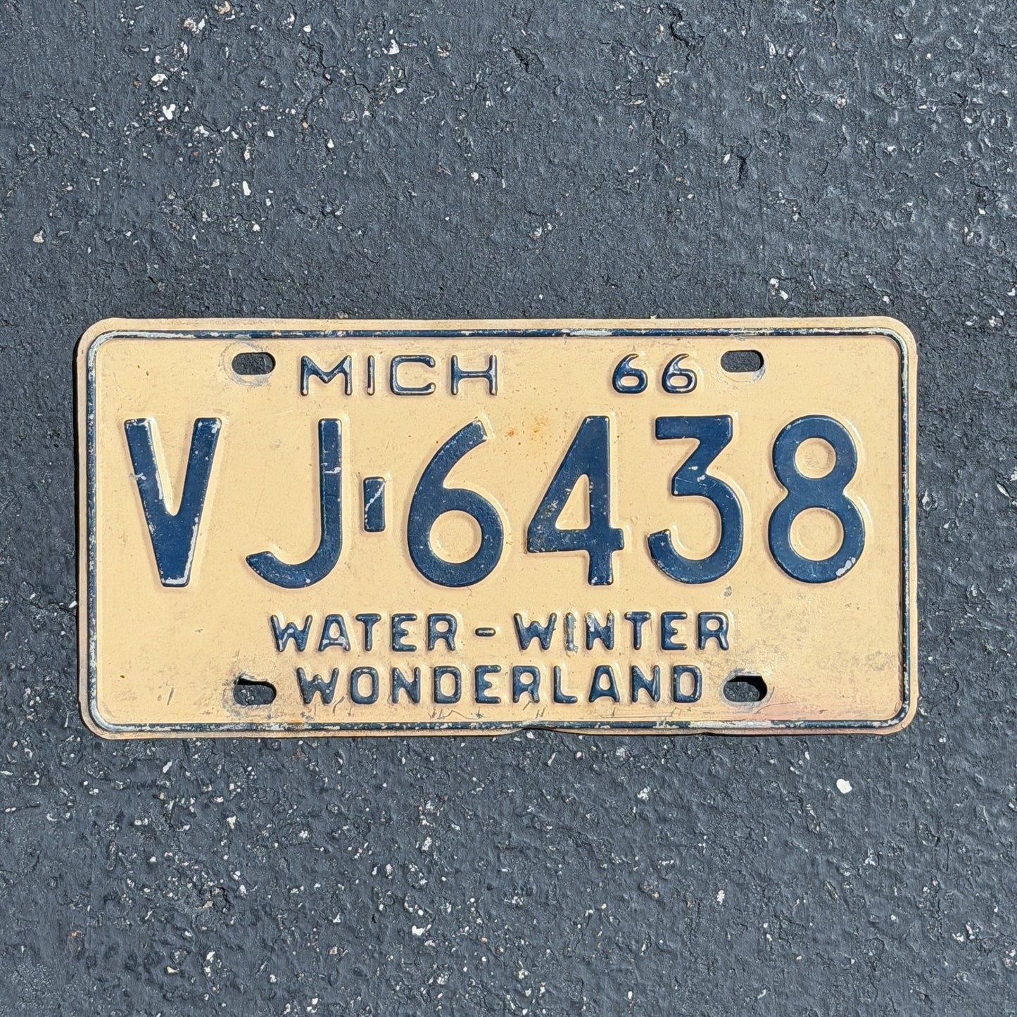Photo of a 1966 Michigan License Plate Auto Tag Garage Decor Vintage VJ 6438 with original patina