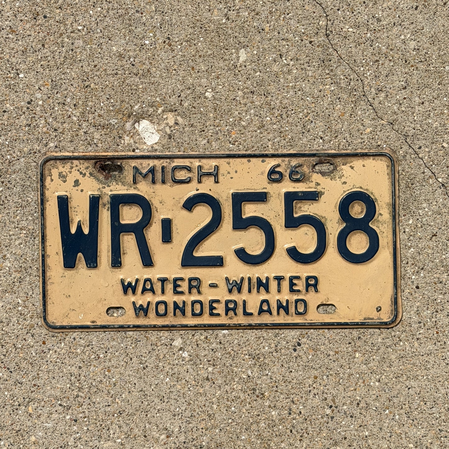 Photo of a 1966 Michigan License Plate Auto Tag Garage Decor Vintage WR 2558 with original patina