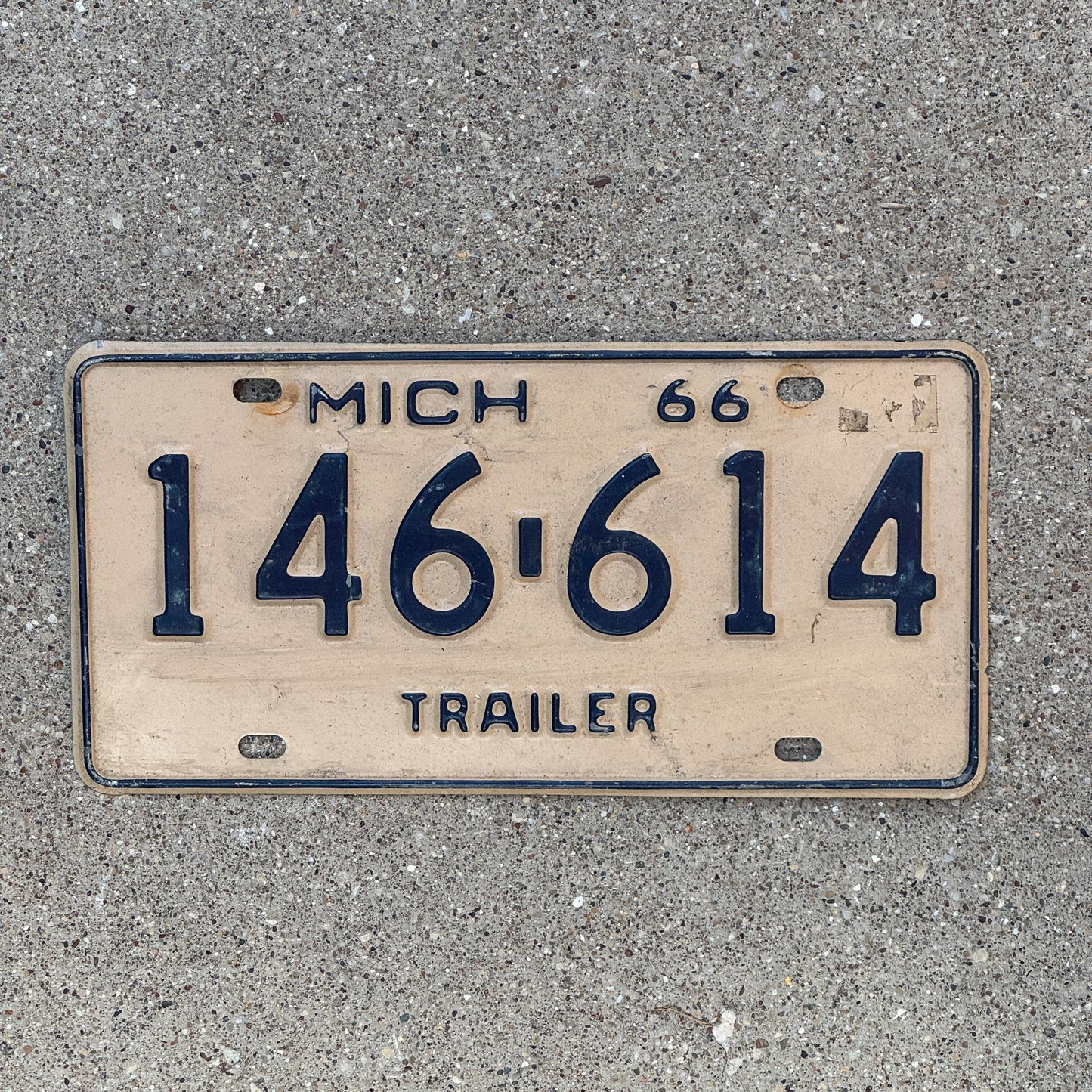 Photo of a 1966 Michigan Trailer License Plate Auto Tag Garage Decor Vintage 146 614