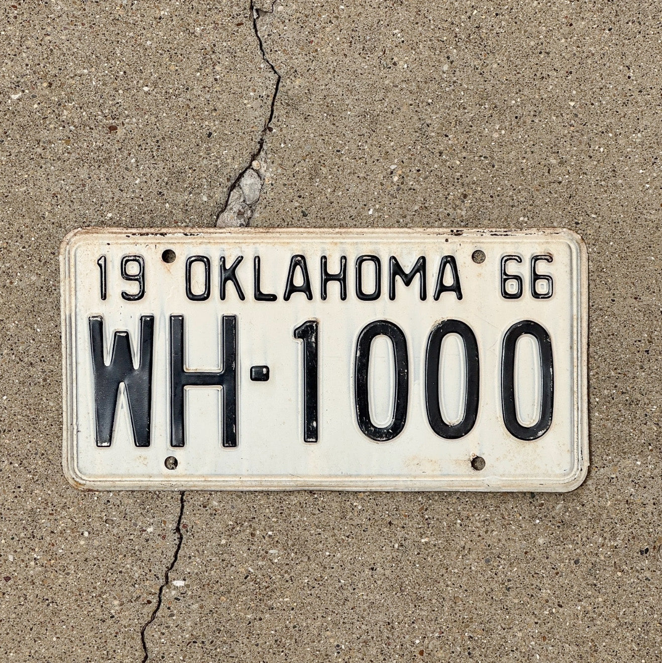 Photo of a 1966 Oklahoma License Plate Auto Tag Garage Decor Vintage Nice Number WH 1000 with original patina