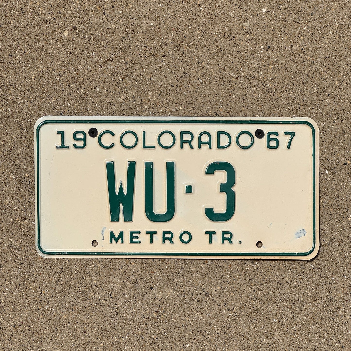 Photo of a 1967 Colorado Metro Tractor License Plate Auto Tag Garage Decor Vintage WU 3