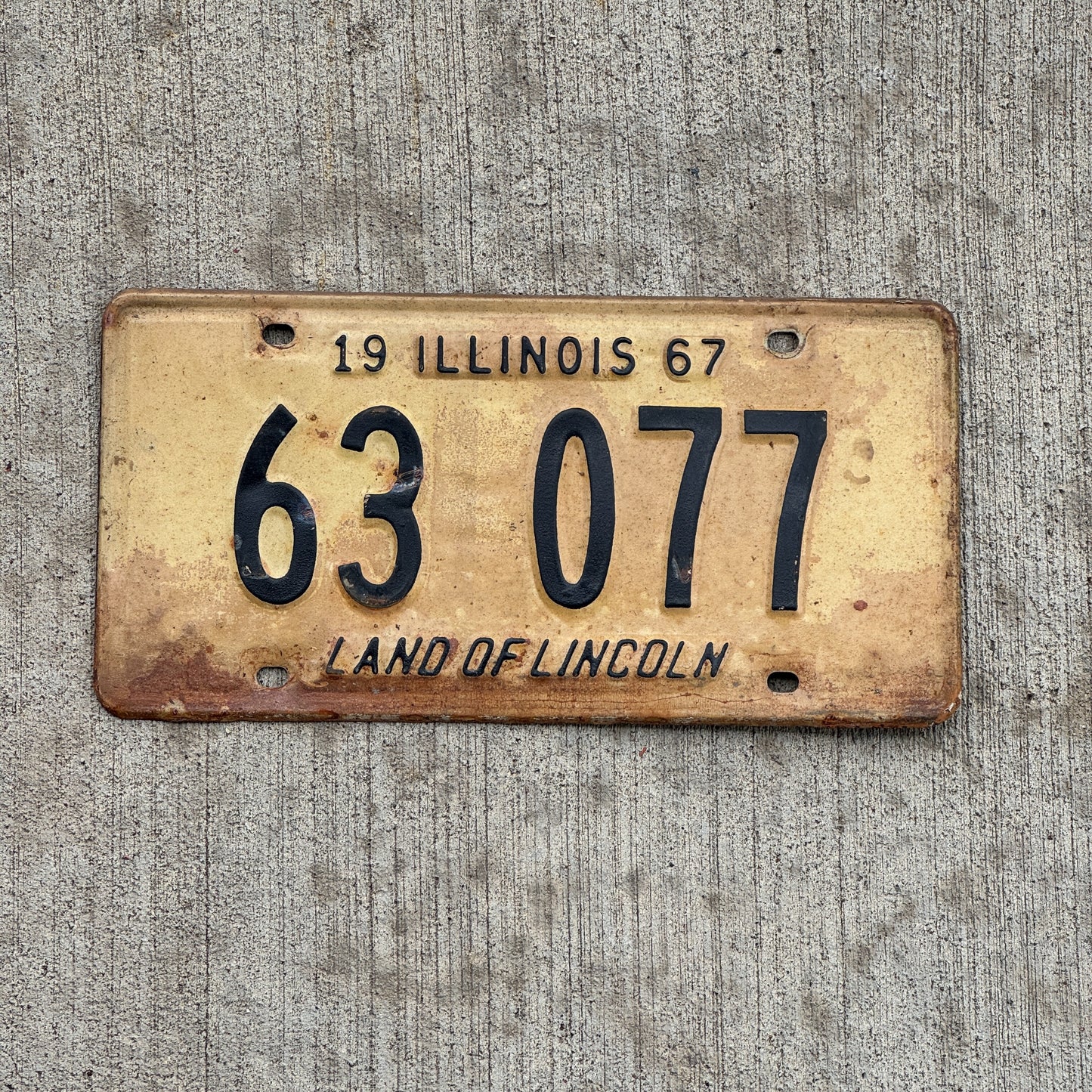 Photo of a 1967 Illinois License Plate Auto Tag 2 Vintage Garage 63 077 with original patina