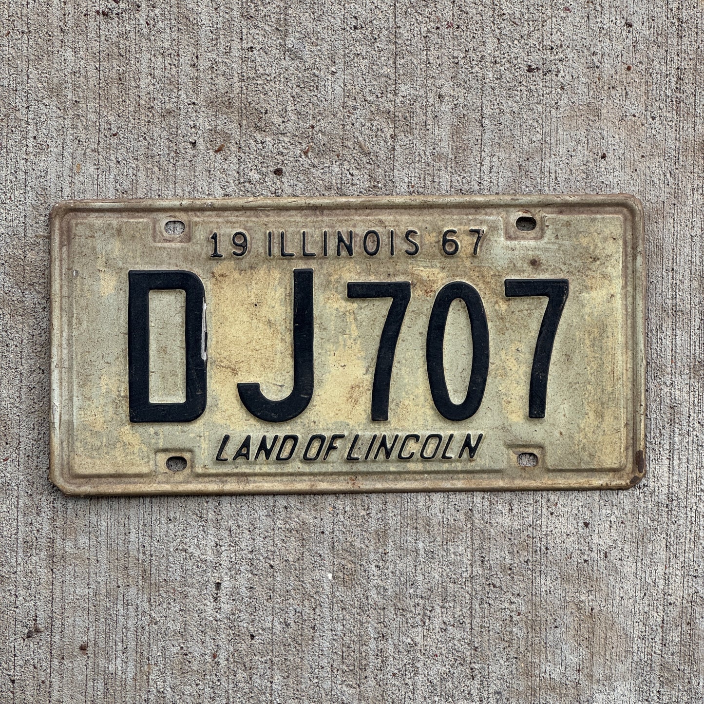 Photo of a 1967 Illinois License Plate Auto Tag 2 Vintage Garage DJ 707 with original patina
