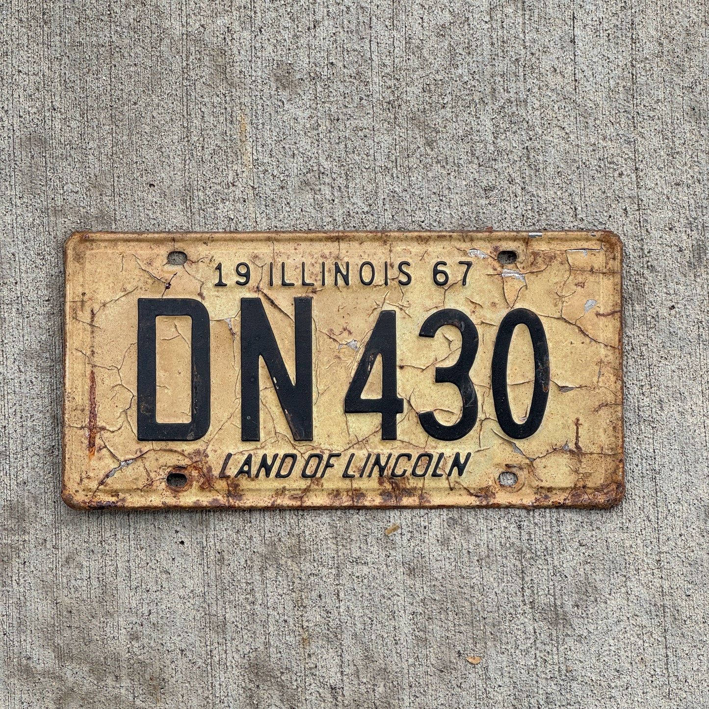 Photo of a 1967 Illinois License Plate Auto Tag 2 Vintage Garage DN 430 with original patina