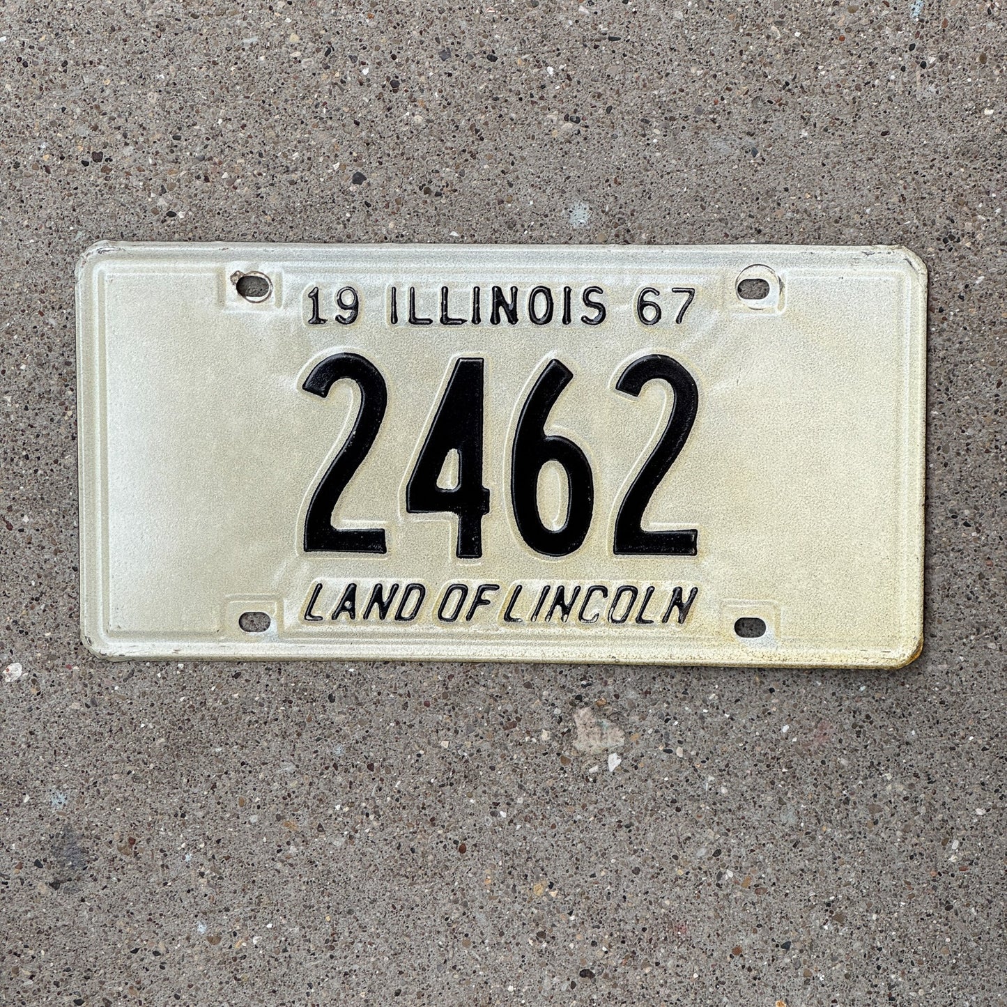 Photo of a 1967 Illinois License Plate Auto Tag Garage Decor Vintage Low Number Four Digit 2462 with original patina