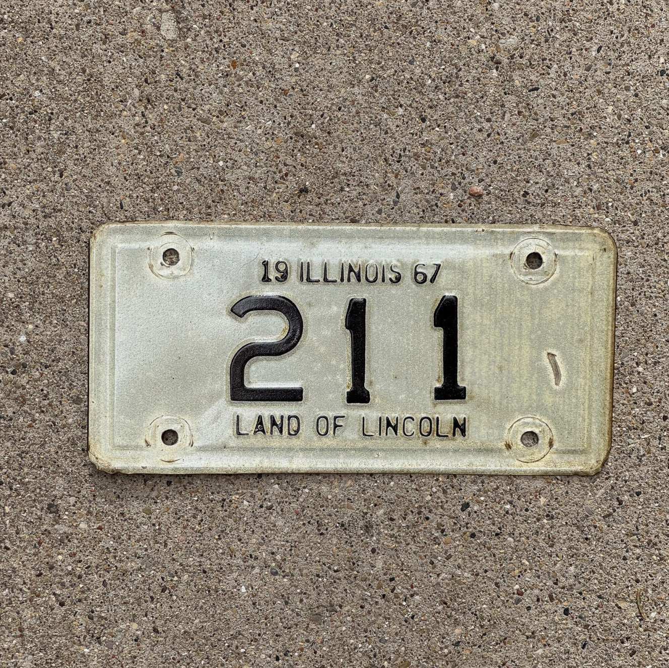 Photo of a 1967 Illinois Motorcycle License Plate Auto Tag Garage Decor Vintage Low Number Three Digit 211 with original patina