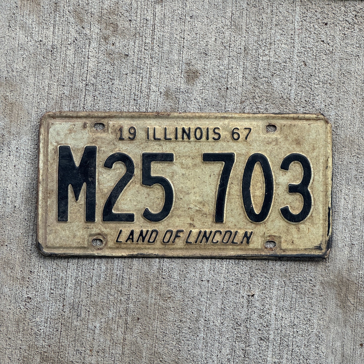 Photo of a 1967 Illinois Municipal License Plate Auto Tag 1 Vintage Garage M 25 703 with original patina