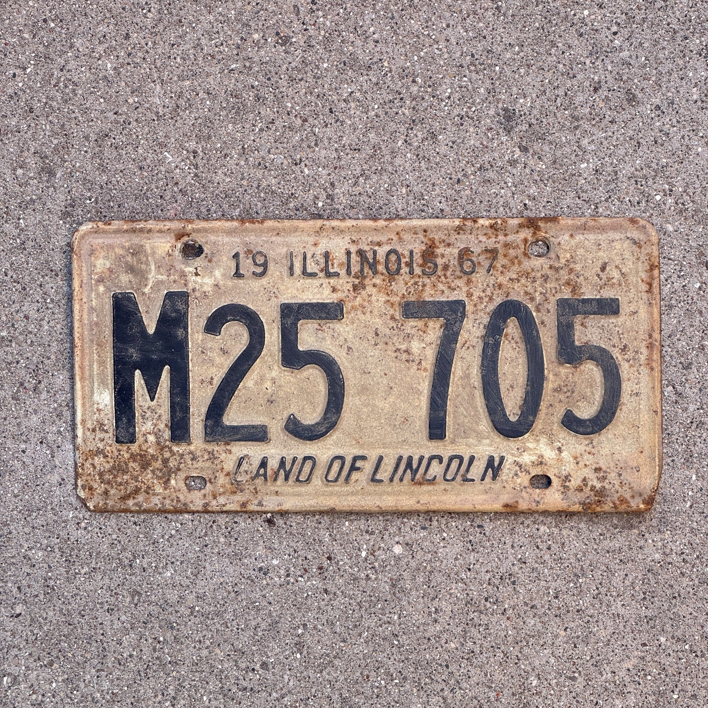 Photo of a 1967 Illinois Municipal License Plate Auto Tag 1 Vintage Garage M 25 705 with original patina