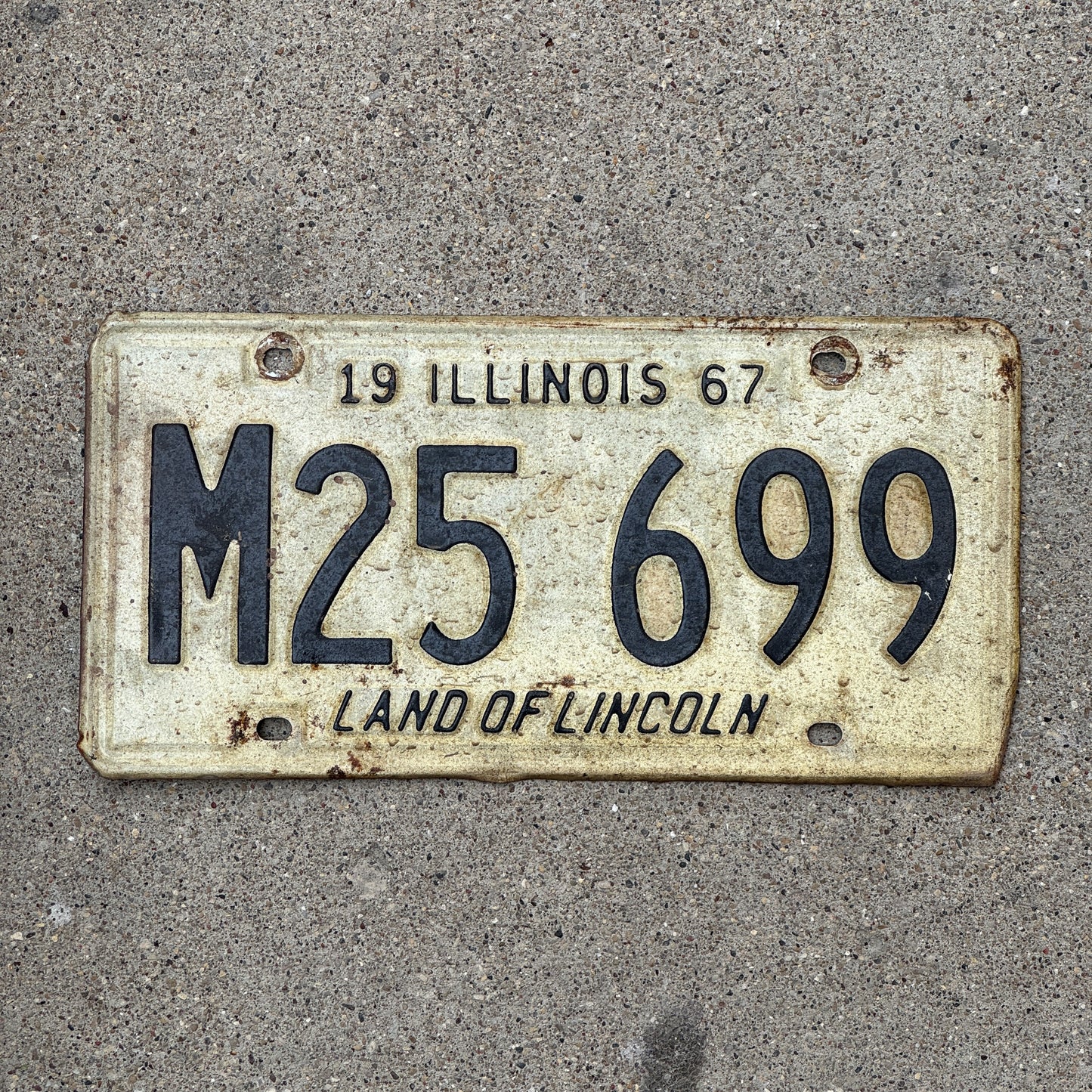 Photo of a 1967 Illinois Municipal License Plate Auto Tag 2 Vintage Garage M 25 699 with original patina