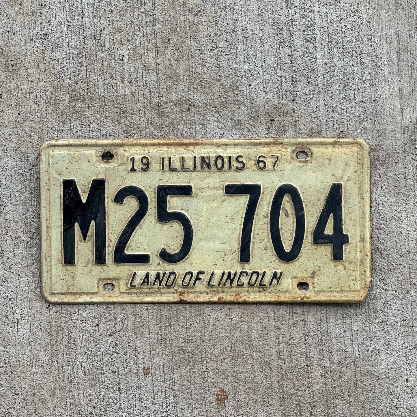 Photo of a 1967 Illinois Municipal License Plate Auto Tag Garage Decor Vintage M 25 704 with original patina