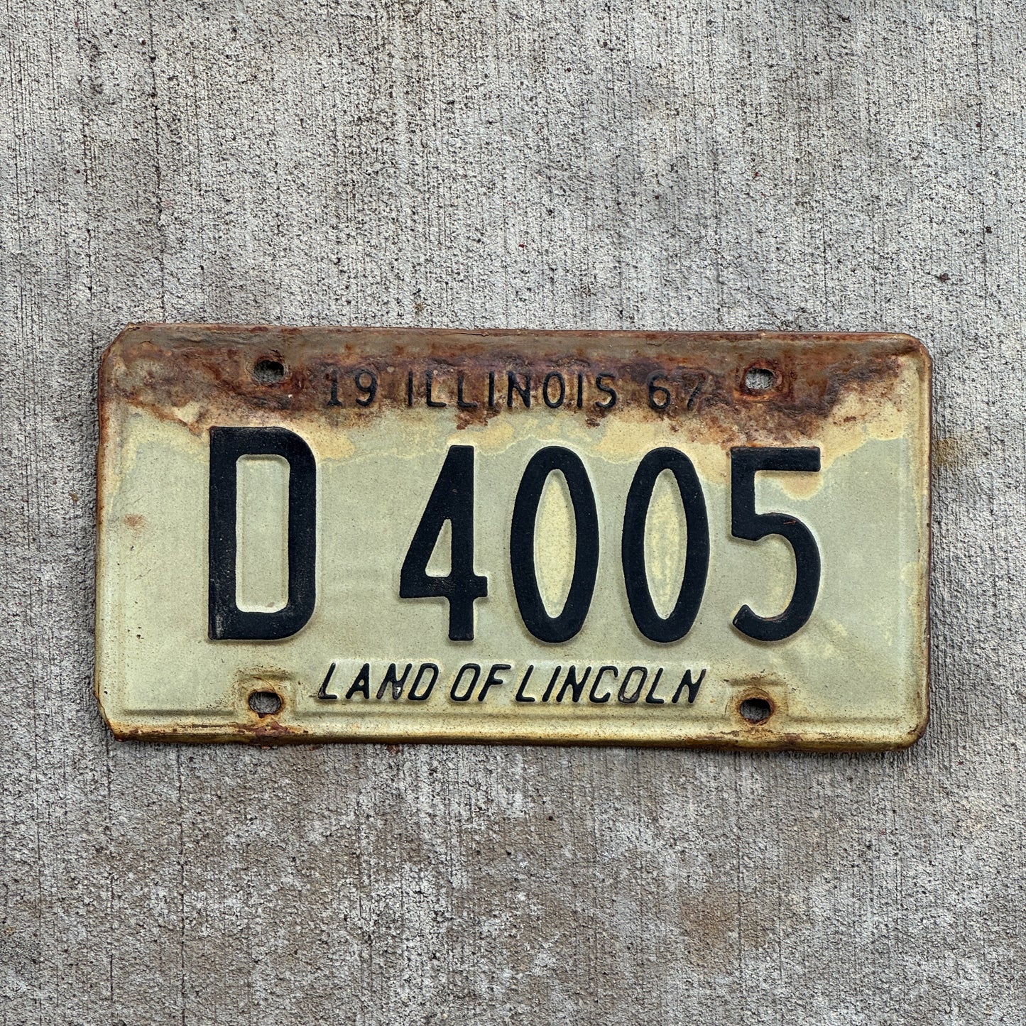 Photo of a 1967 Illinois Truck License Plate Auto Tag Garage Decor Vintage D 4005 with original patina