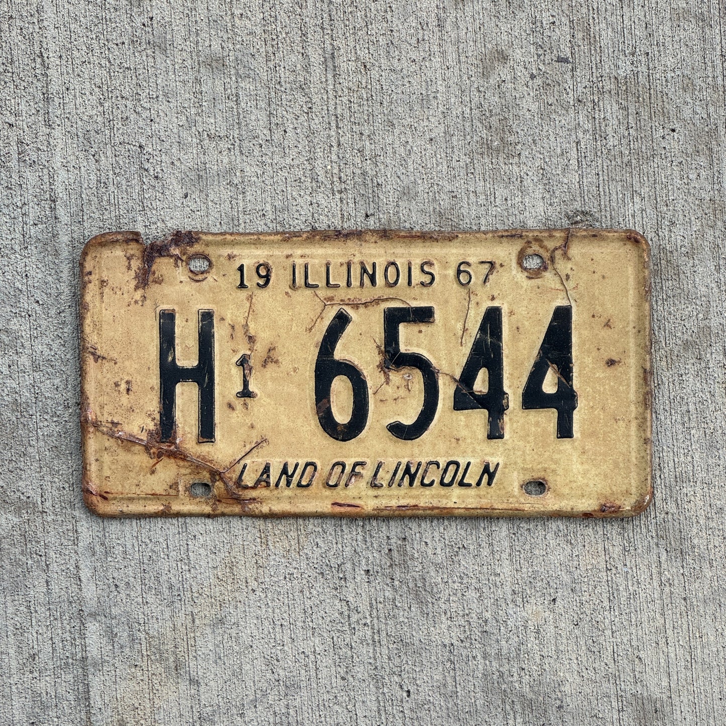 Photo of a 1967 Illinois Truck License Plate Auto Tag Garage Decor Vintage H1 6544 with original patina