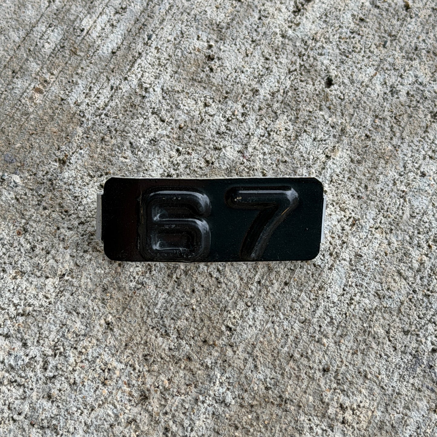 Photo of a 1967 Maine Tab License Plate Auto Tag Garage Decor Vintage with original patina