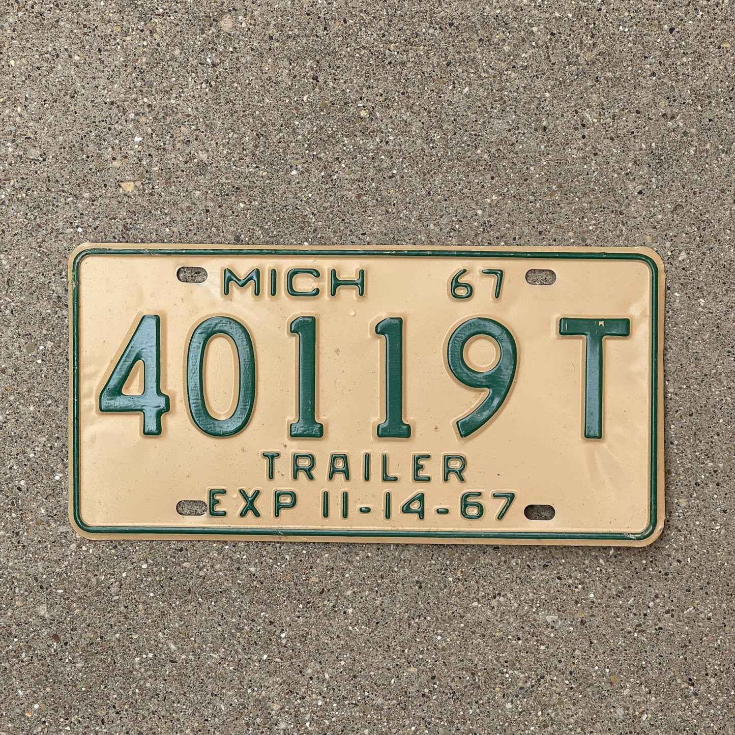 Photo of a 1967 Michigan Trailer Half Year License Plate Auto Tag Garage Decor Vintage 40119 T
