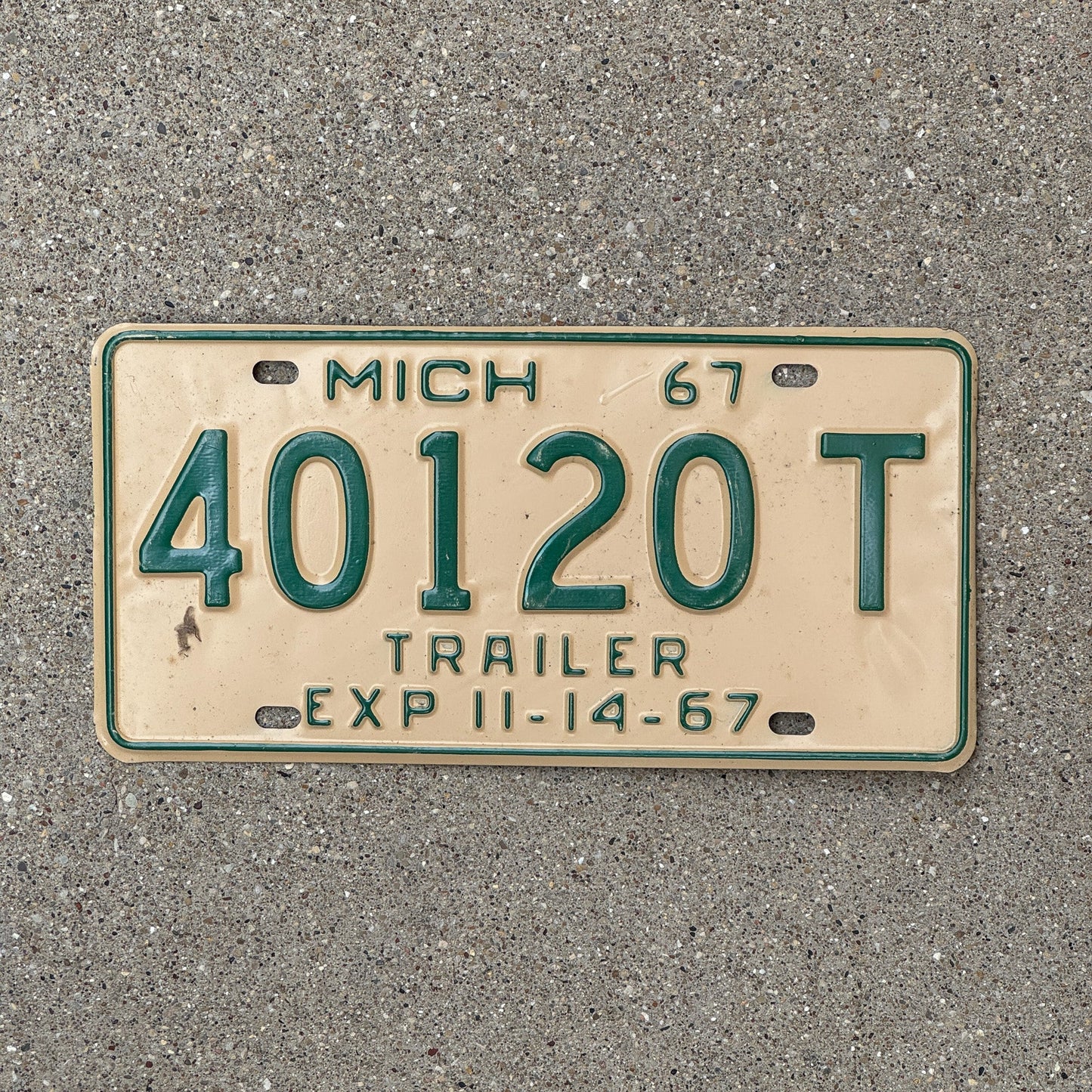 Photo of a 1967 Michigan Trailer Half Year License Plate Auto Tag Garage Decor Vintage 40120 T