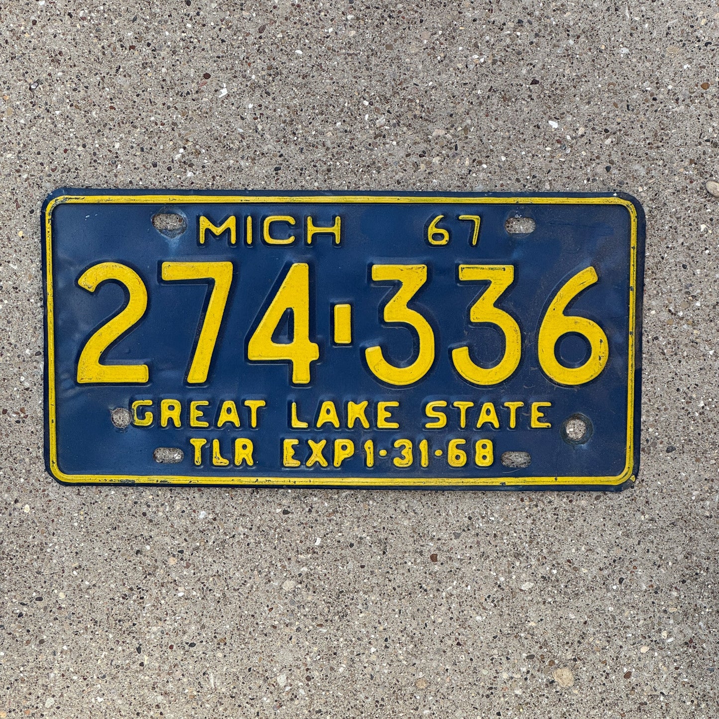Photo of a 1967 Michigan Trailer License Plate Auto Tag Garage Decor Vintage 274 336