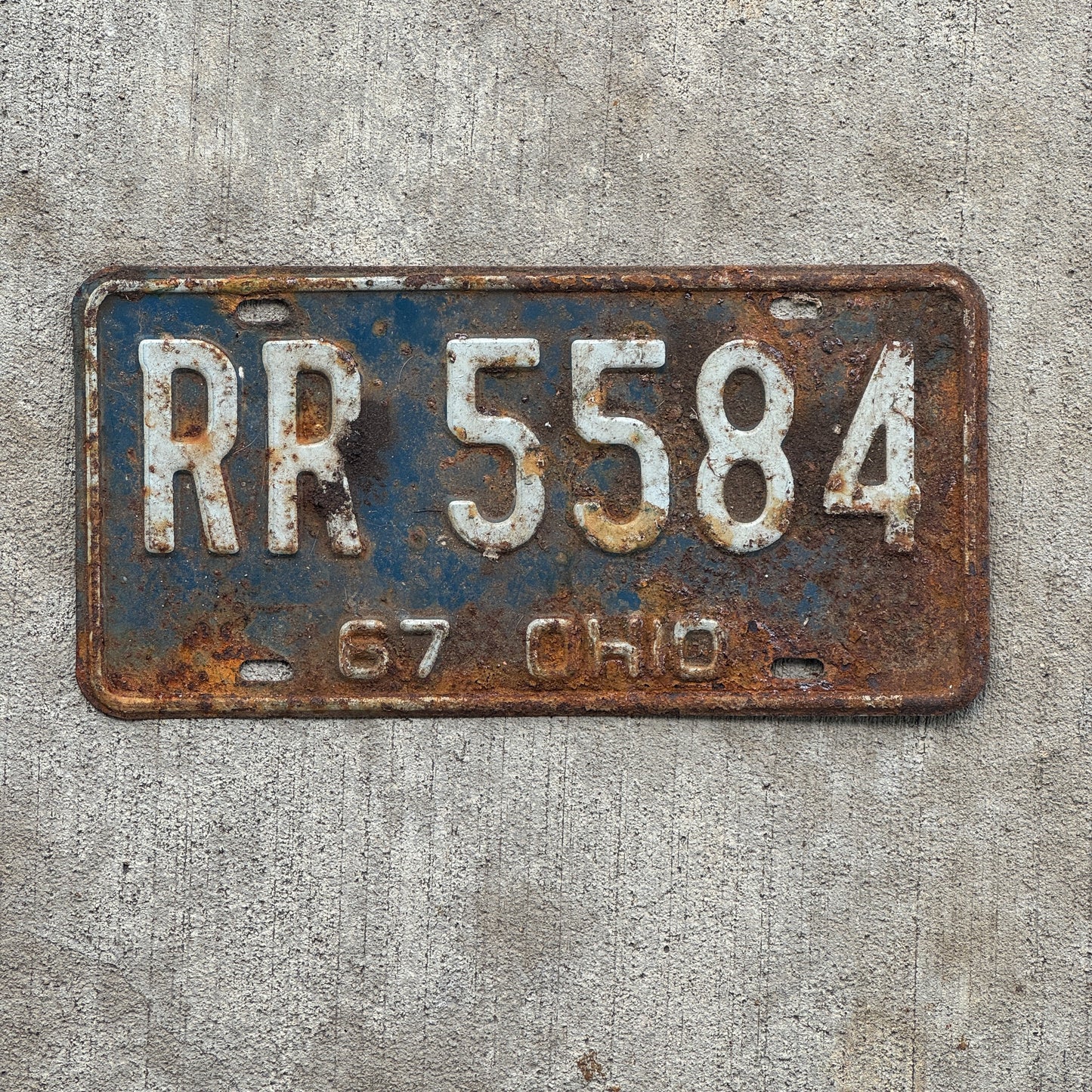 Photo of a 1967 Ohio License Plate Auto Tag Garage Decor Vintage RR 5584 with original patina