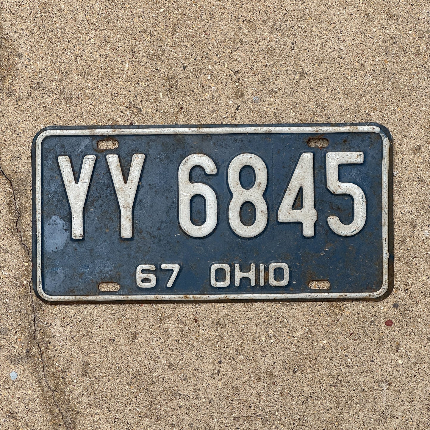 Photo of a 1967 Ohio License Plate Auto Tag Garage Decor Vintage YY 6845 with original patina