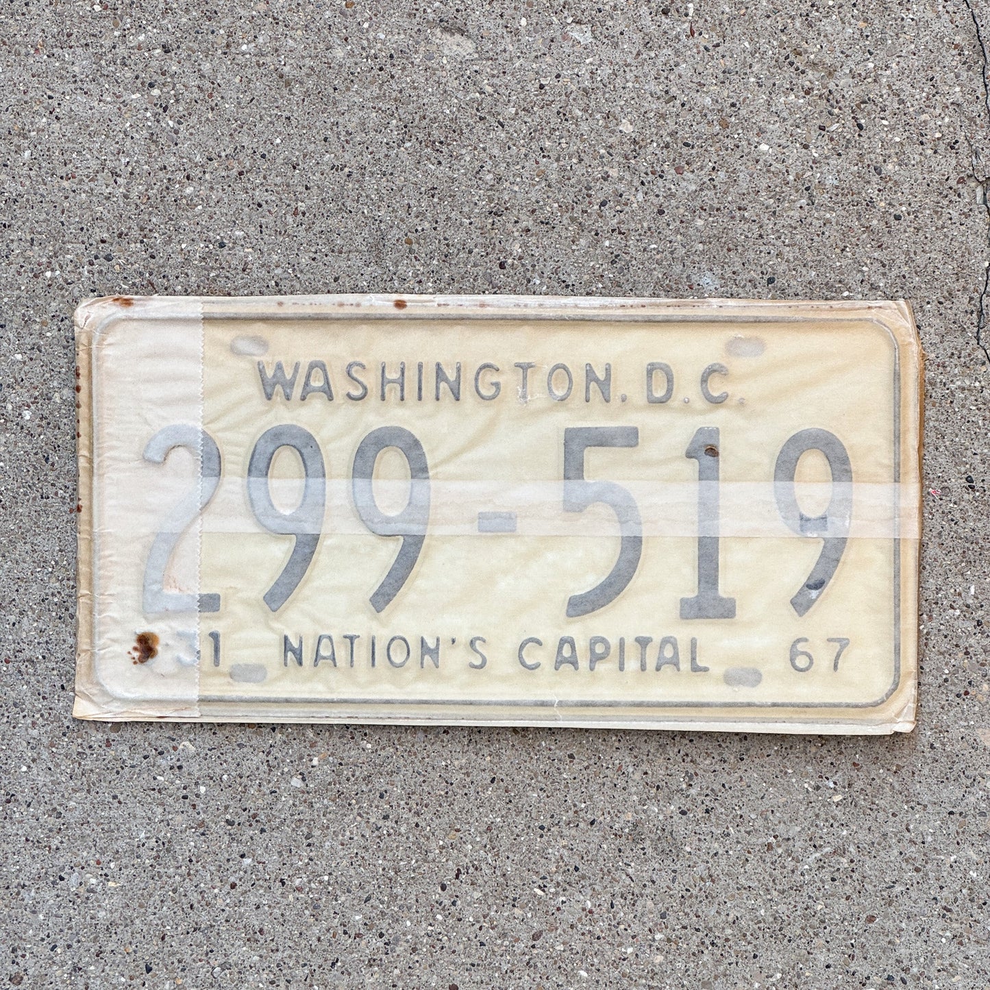 Photo of a 1967 Washington DC License Plate Pair Auto Tag Garage Decor Vintage with Envelope 299 519 with original patina