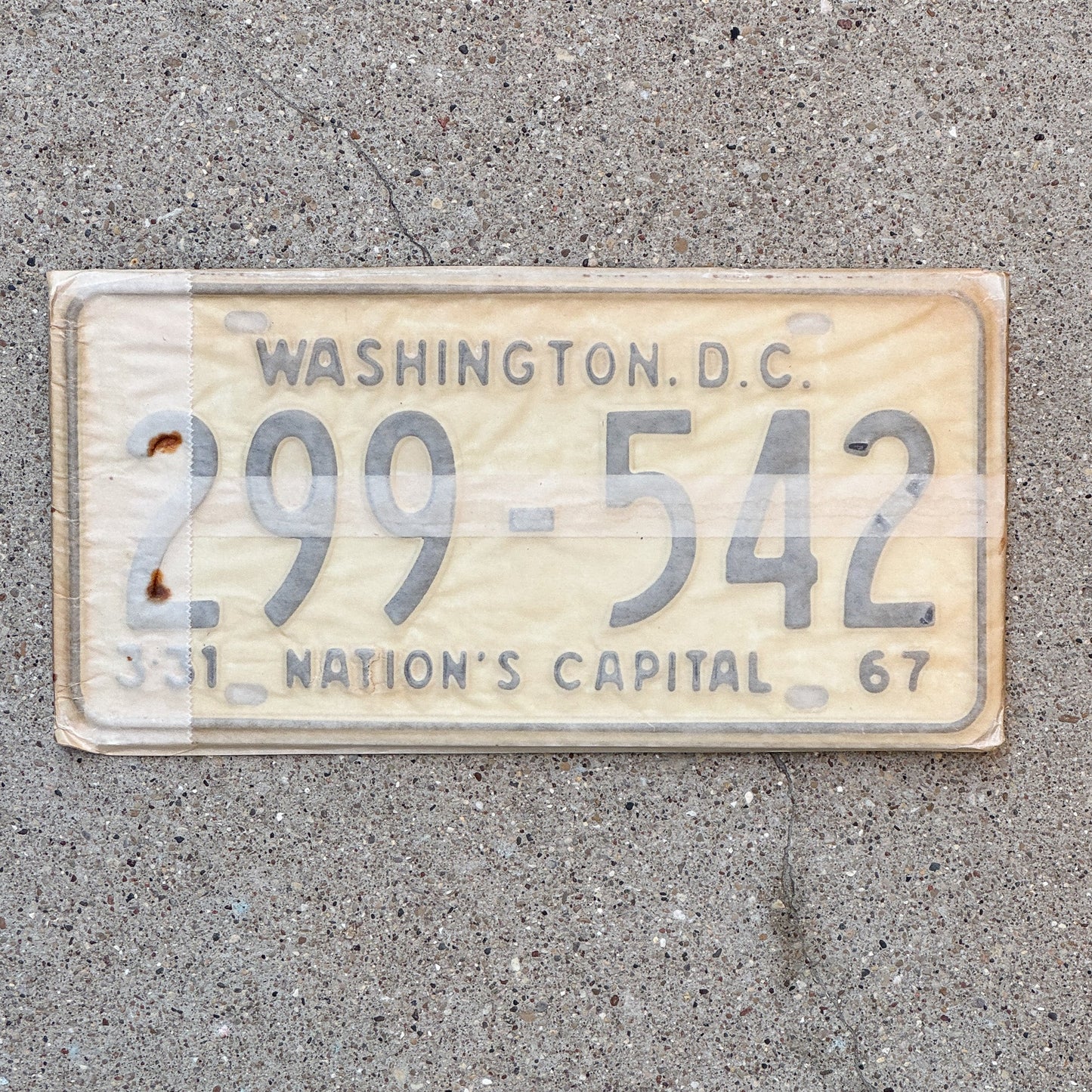 Photo of a 1967 Washington DC License Plate Pair Auto Tag Garage Decor Vintage with Envelope 299 542 with original patina