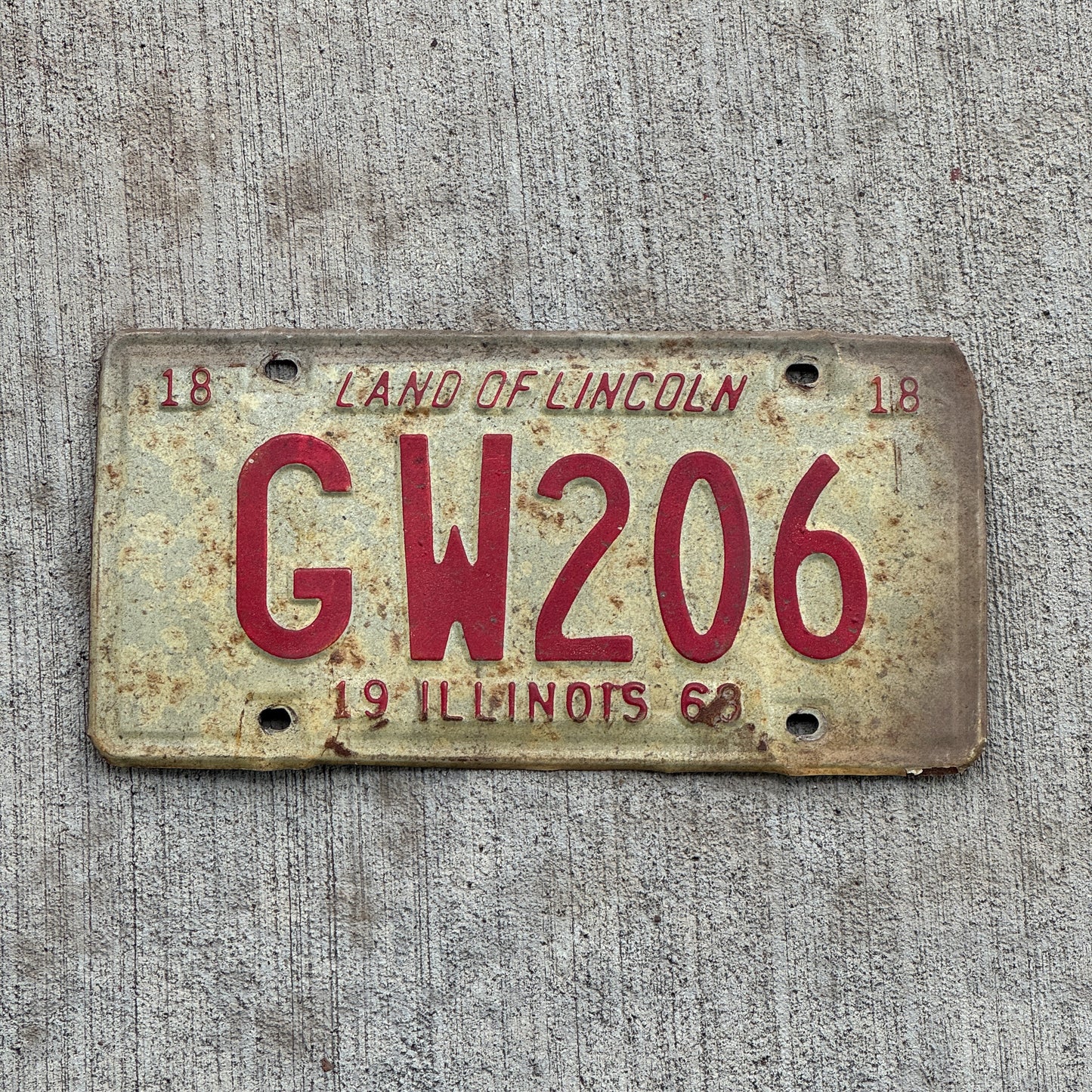 Photo of a 1968 Illinois License Plate Auto Tag 2 Vintage Garage GW 206 with original patina