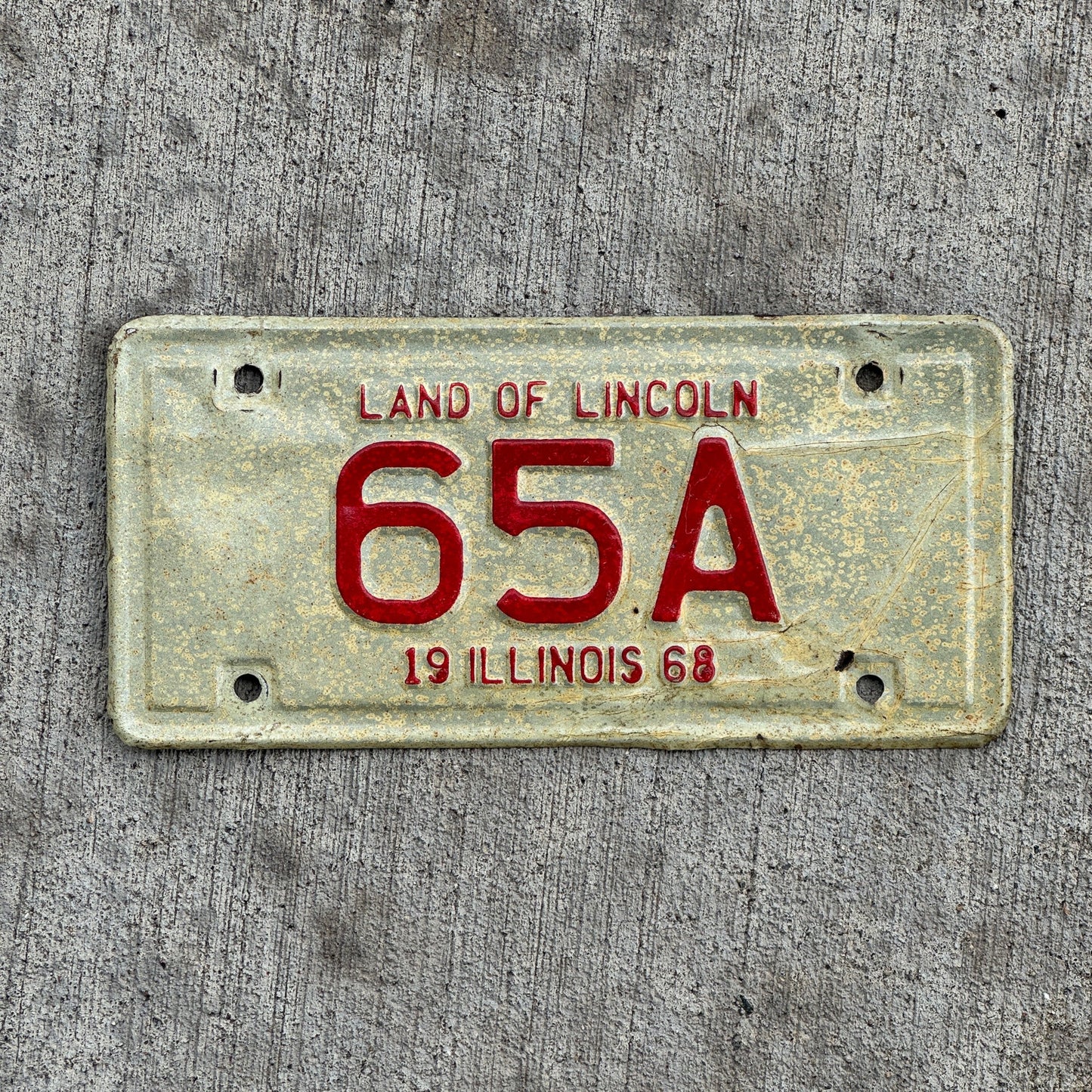 Photo of a 1968 Illinois Moped License Plate Auto Tag Garage Decor Vintage Two Digit First Year of Type 65 A with original patina