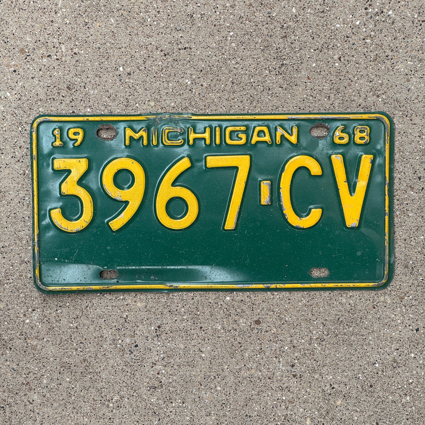 Photo of a 1968 Michigan Commercial Truck License Plate Auto Tag Garage Decor Vintage 3967 CV