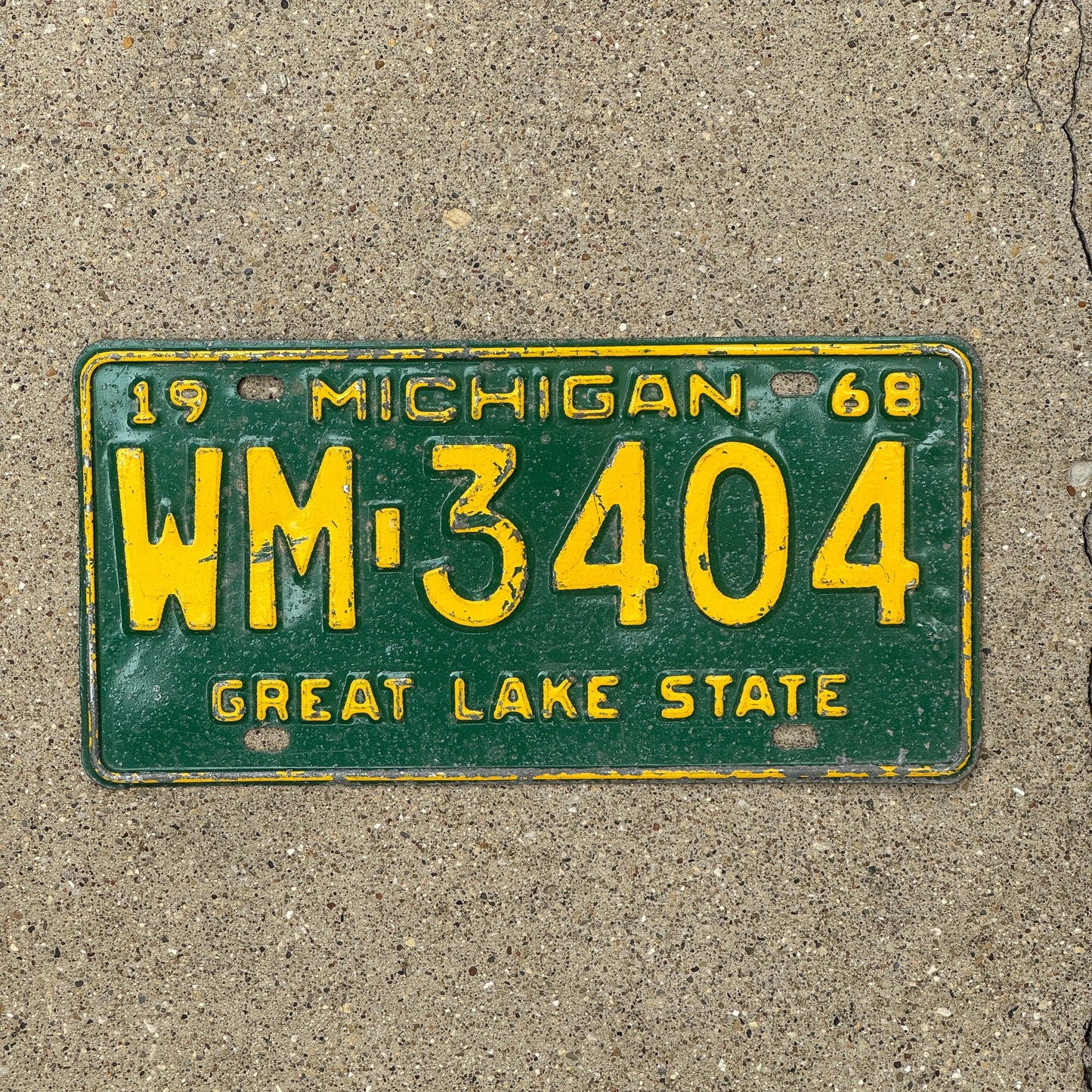 Photo of a 1968 Michigan License Plate Auto Tag Garage Decor Vintage WM 3404