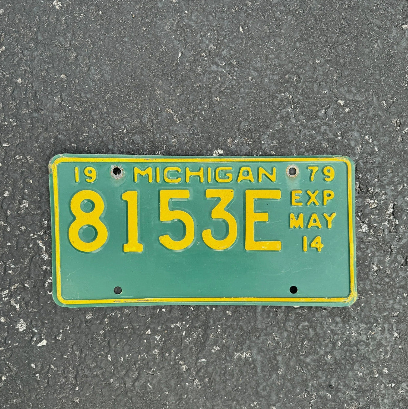 Photo of a 1968 Michigan Truck License Plate Auto Tag Garage Decor Vintage Half Year May 8153 E