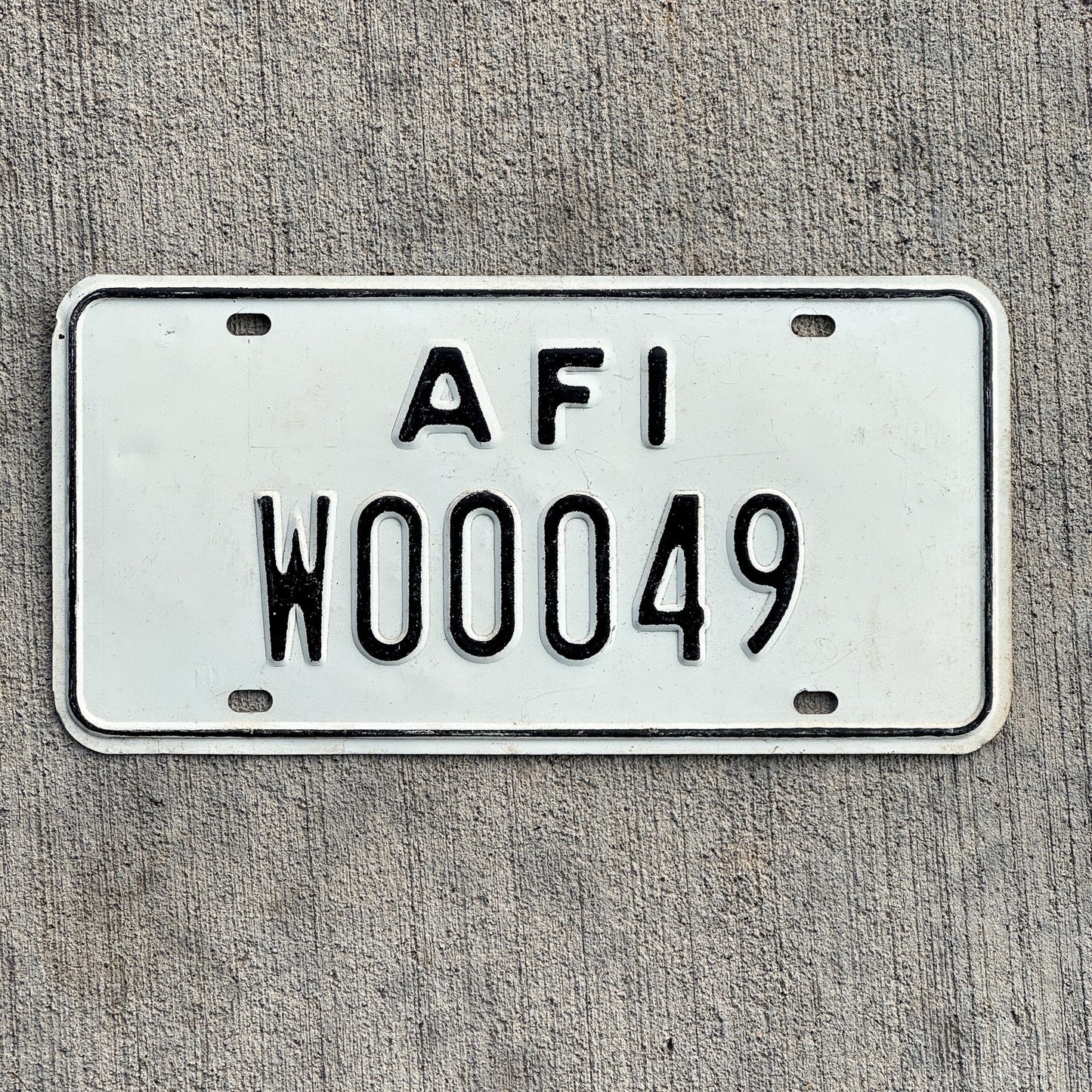 Photo of a 1968 US Forces Italy License Plate Auto Tag 1 Vintage Garage American Military 00049 with original patina