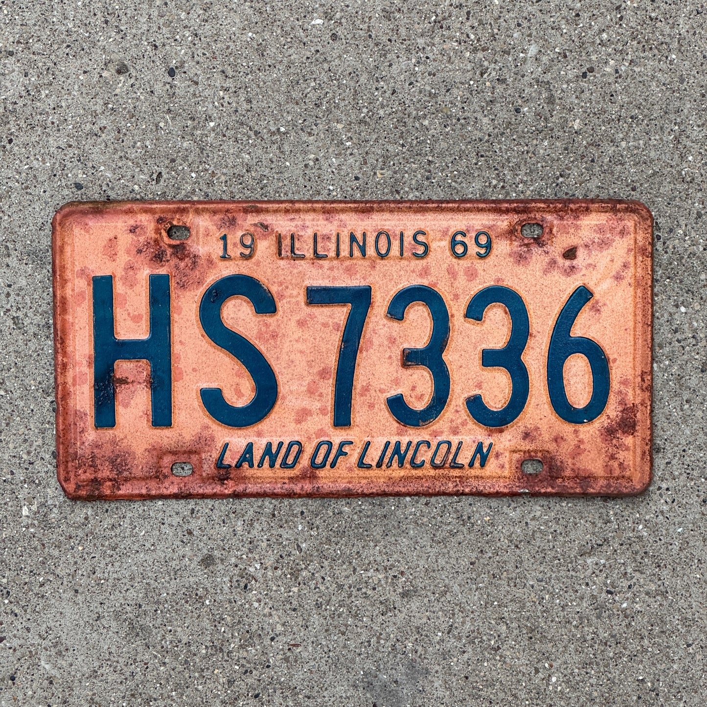 Photo of a 1969 Illinois License Plate Auto Tag Garage Decor Vintage HS 7336 with original patina