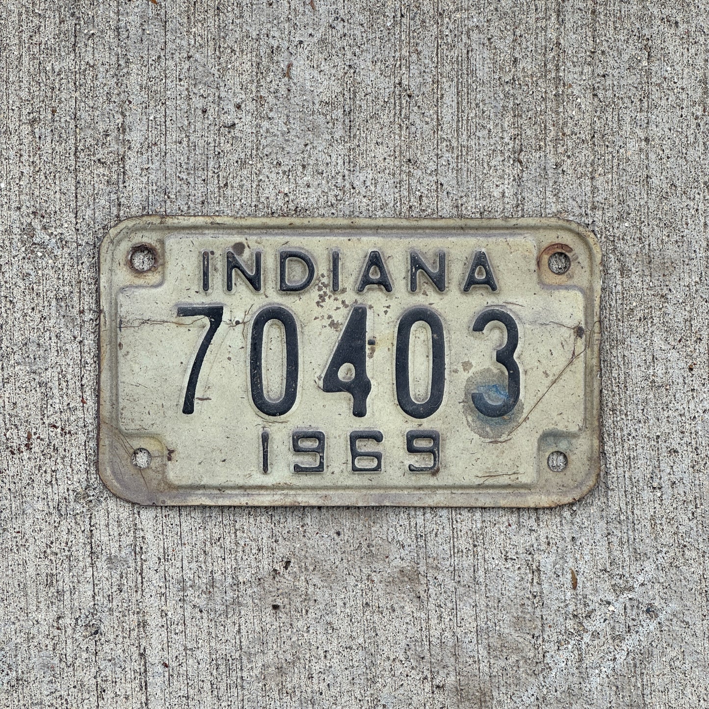 Photo of a 1969 Indiana Motorcycle License Plate Auto Tag Garage Decor Vintage 70403 with original patina