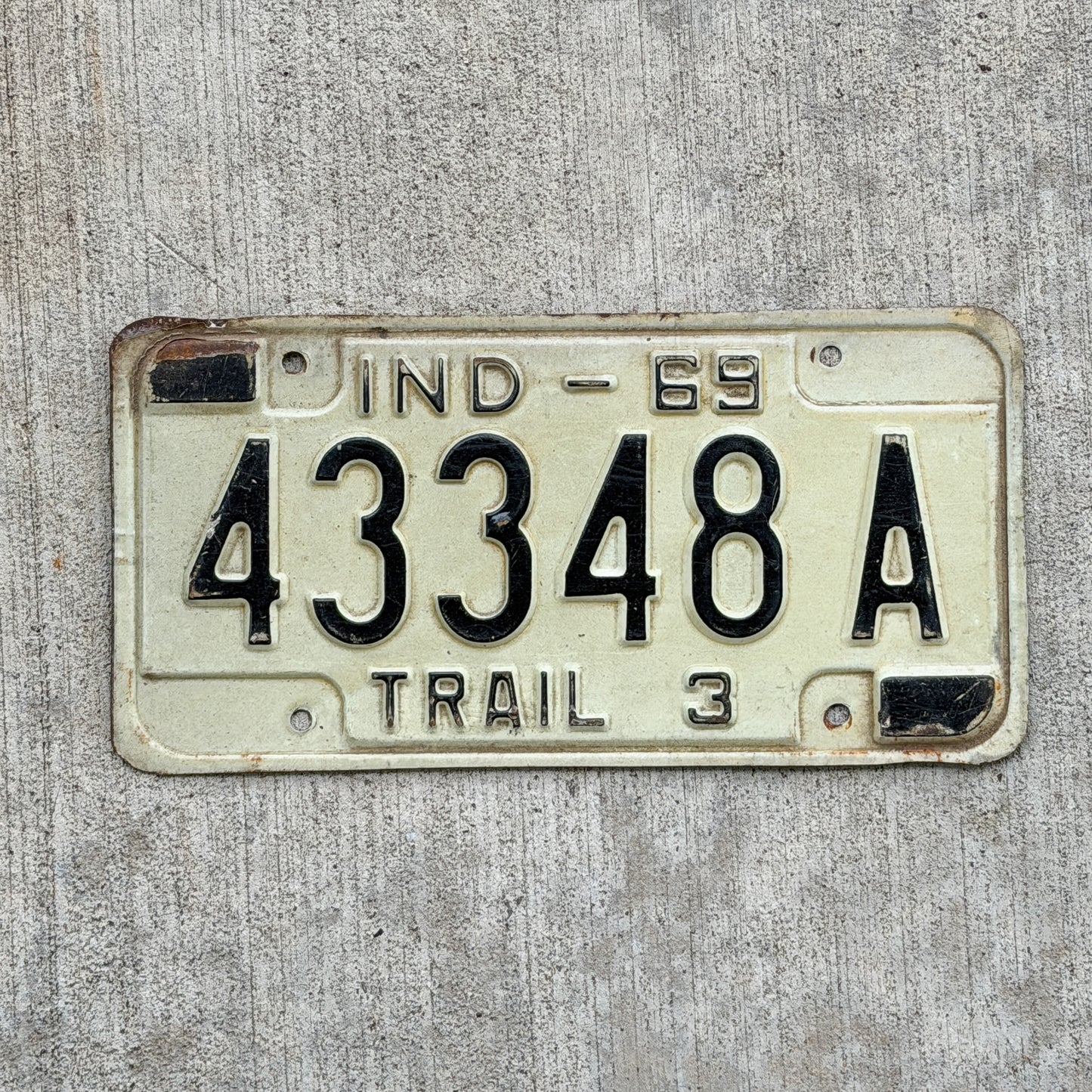 Photo of a 1969 Indiana Trailer License Plate Auto Tag Garage Decor Vintage 43348 A with original patina