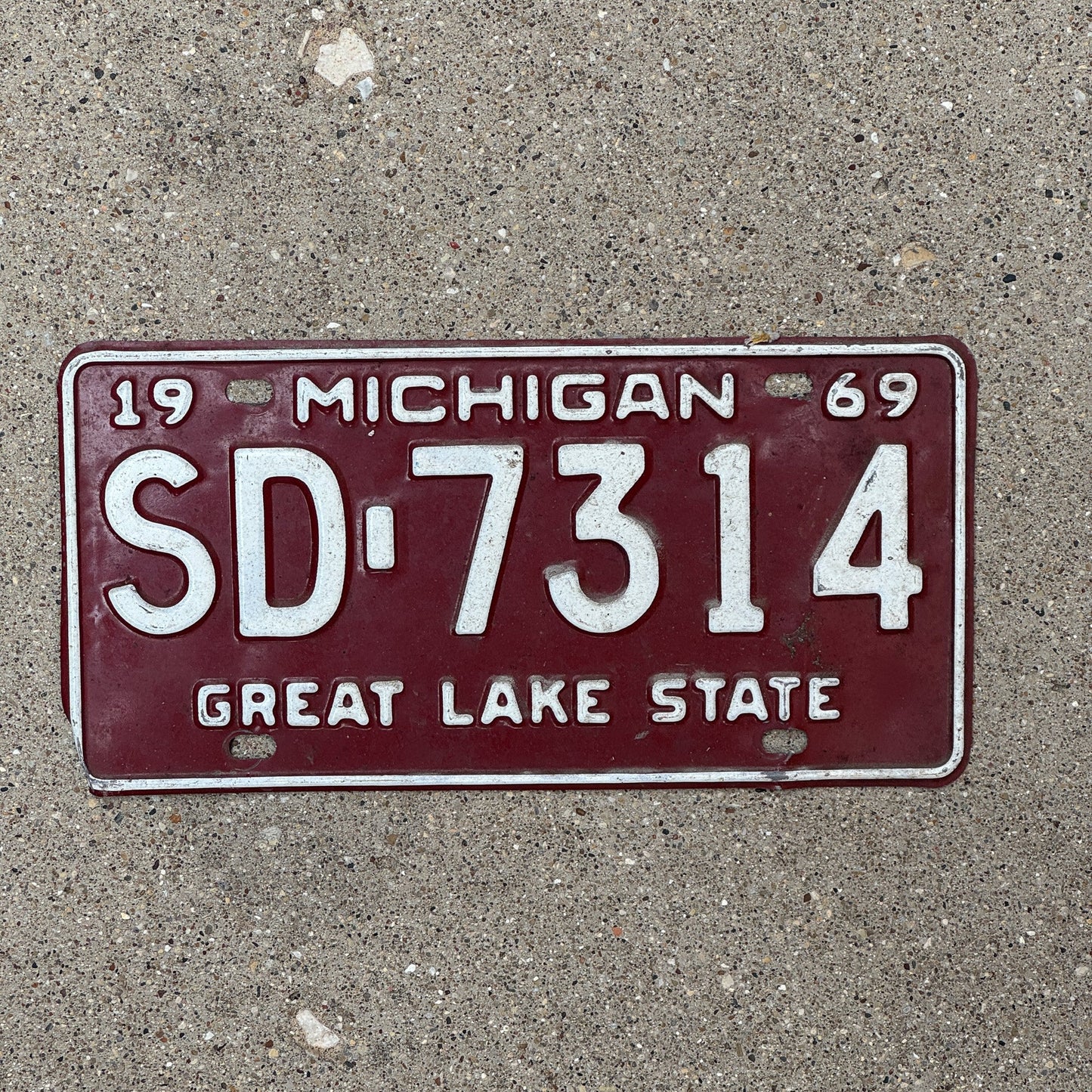 Photo of a 1969 Michigan License Plate Auto Tag Garage Decor Vintage SD 7314