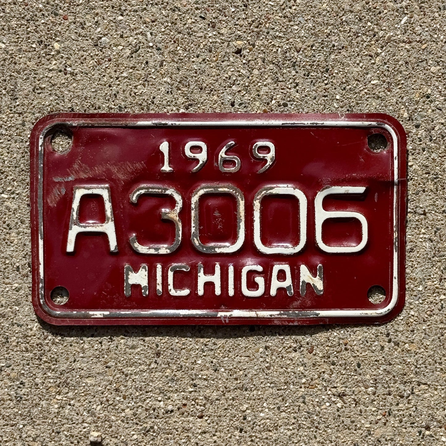 Photo of a 1969 Michigan Motorcycle License Plate Auto Tag Garage Decor Vintage A Series A 3006