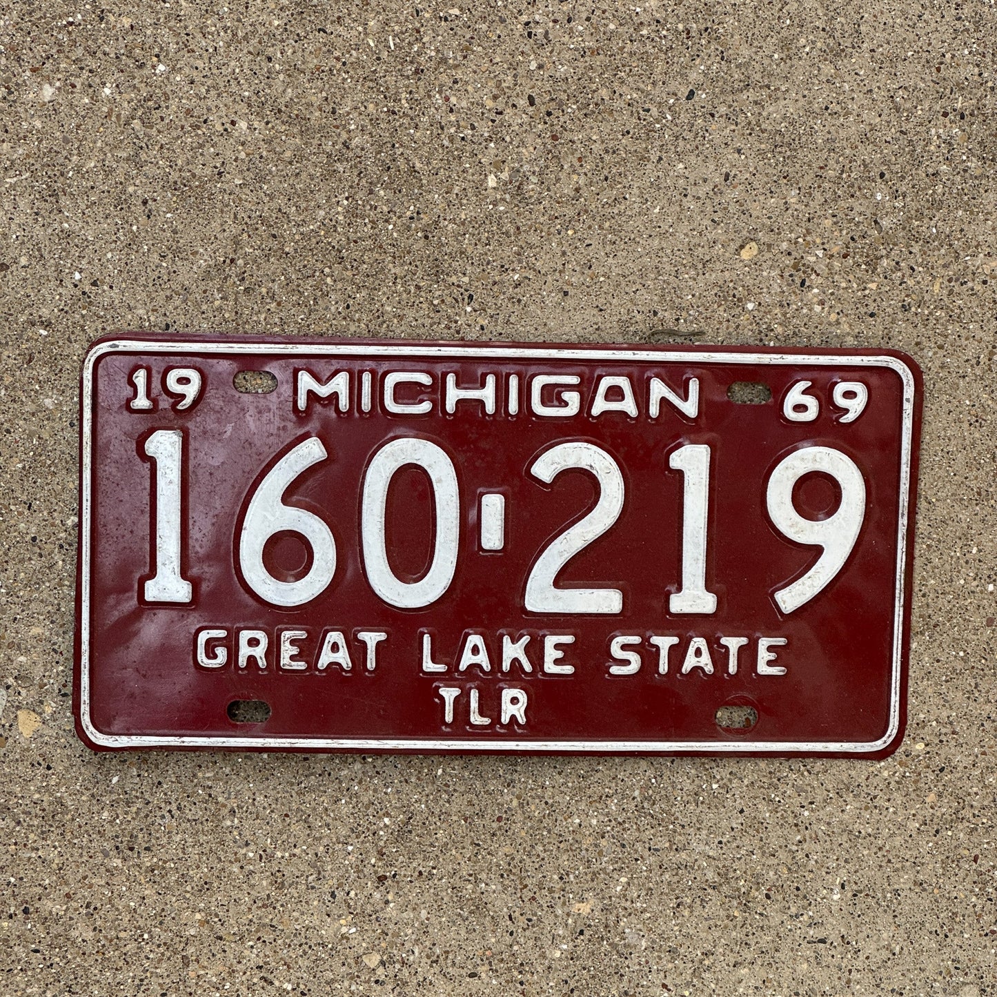 Photo of a 1969 Michigan Trailer License Plate Auto Tag Garage Decor Vintage 160 219
