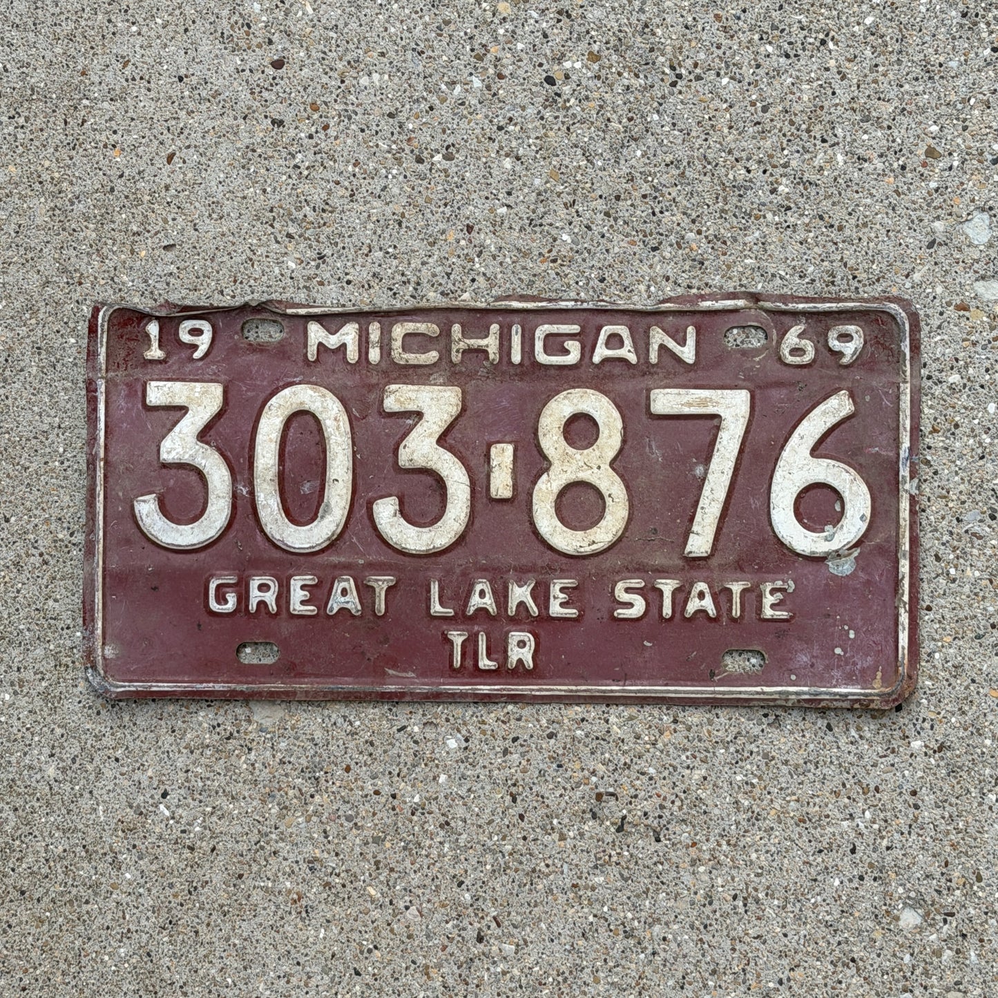 Photo of a 1969 Michigan Trailer License Plate Auto Tag Garage Decor Vintage 303 876 with original patina
