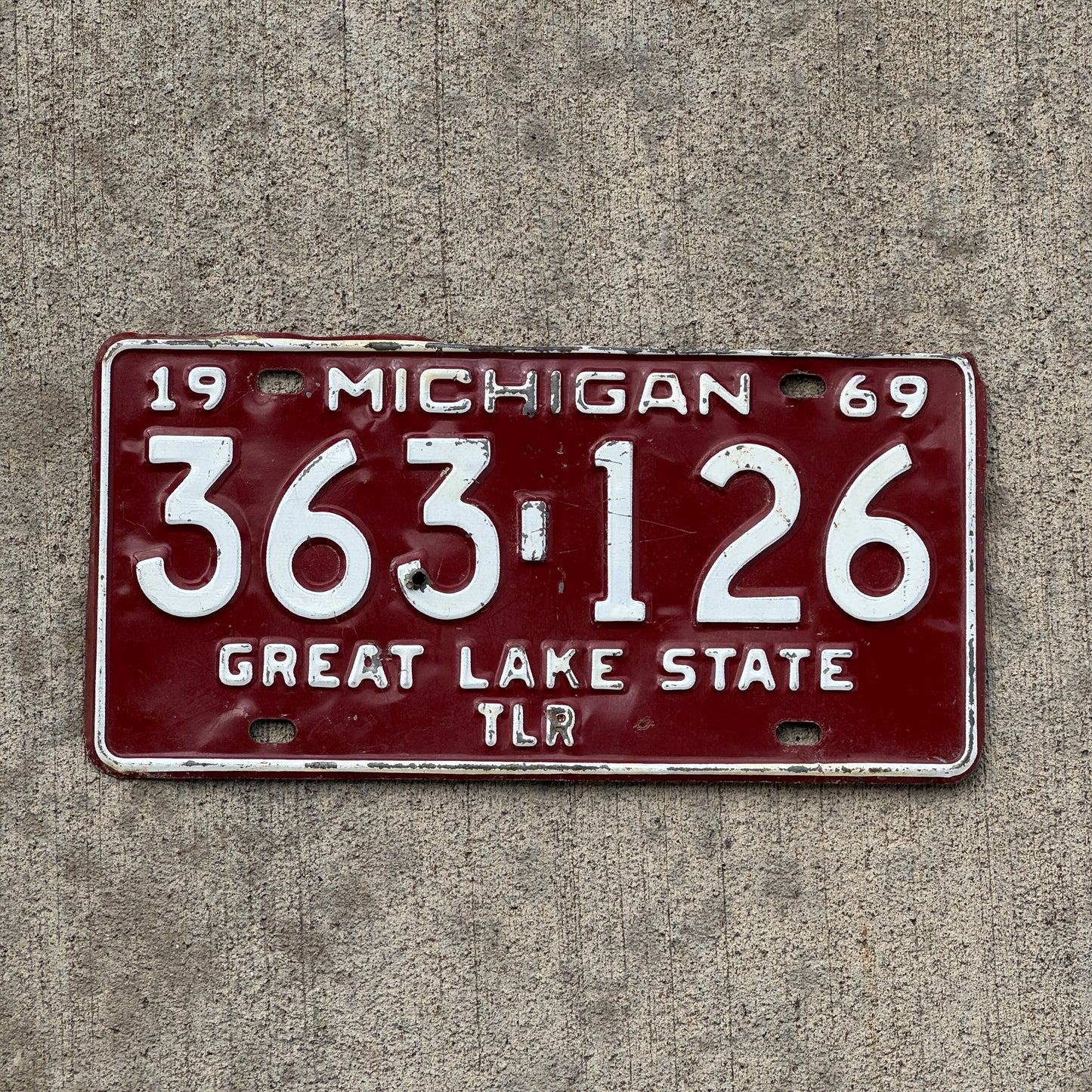 Photo of a 1969 Michigan Trailer License Plate Auto Tag Garage Decor Vintage 363 126 with original patina