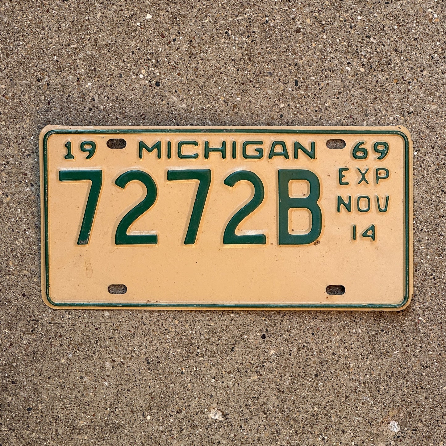 Photo of a 1969 Michigan Truck Half Year License Plate Auto Tag Garage Decor Vintage November 7272 B