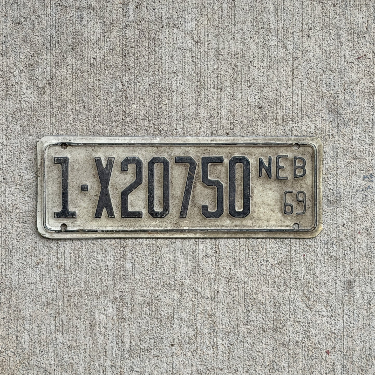 Photo of a 1969 Nebraska Farm Trailer License Plate Auto Tag Garage Decor Vintage 1 X20750 with original patina