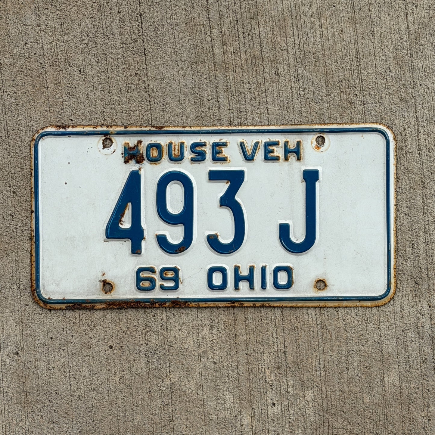 Photo of a 1969 Ohio House Vehicle License Plate Auto Tag Garage Decor Vintage 493 J with original patina