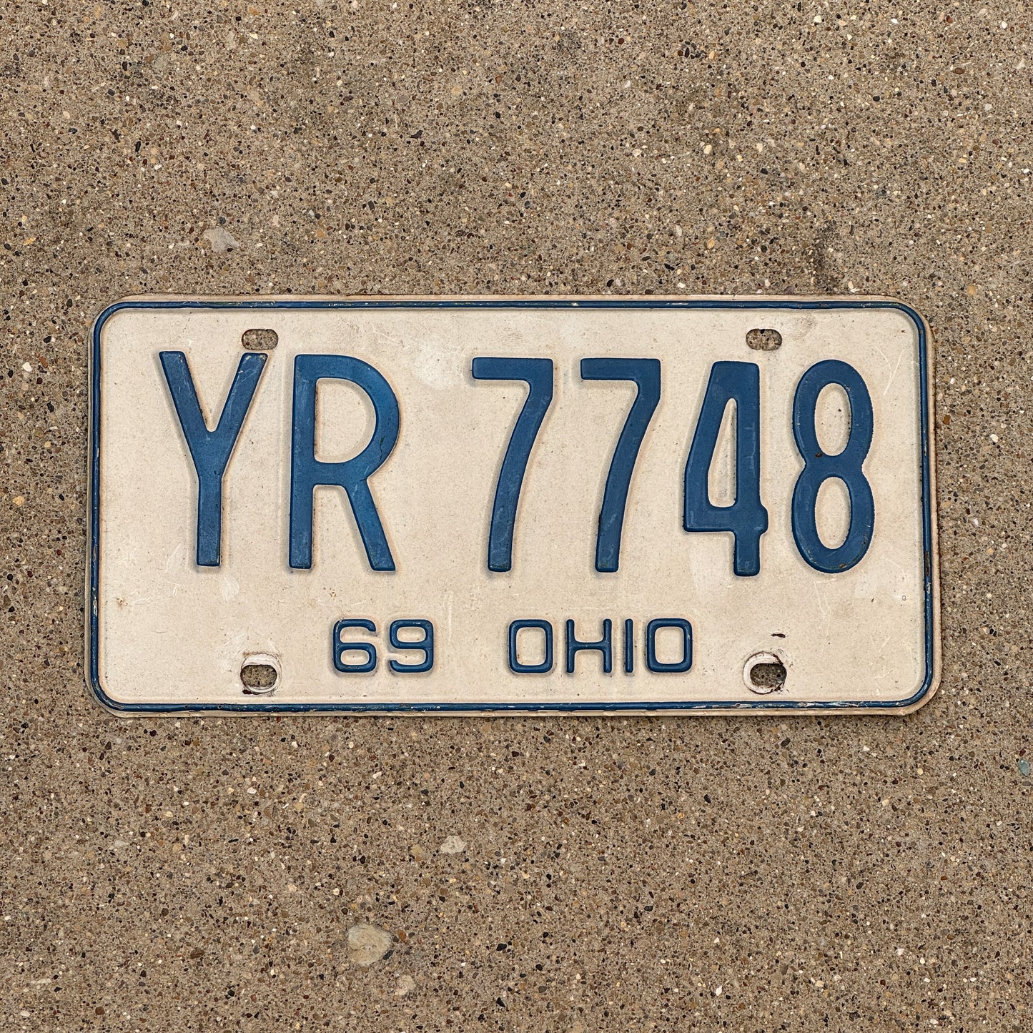 Photo of a 1969 Ohio License Plate Auto Tag 1 Vintage Garage YR 7748 with original patina