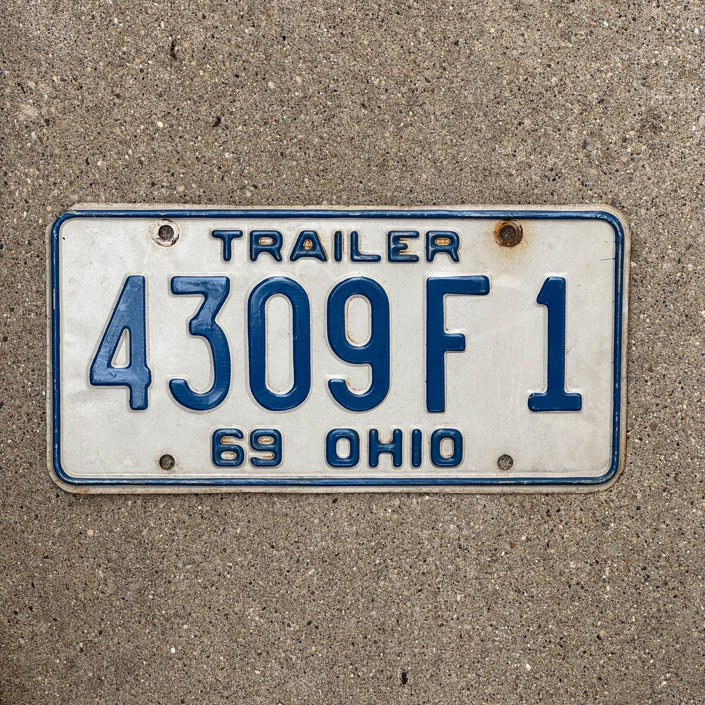 Photo of a 1969 Ohio Trailer License Plate Auto Tag Garage Decor Vintage 4309 F 1 with original patina