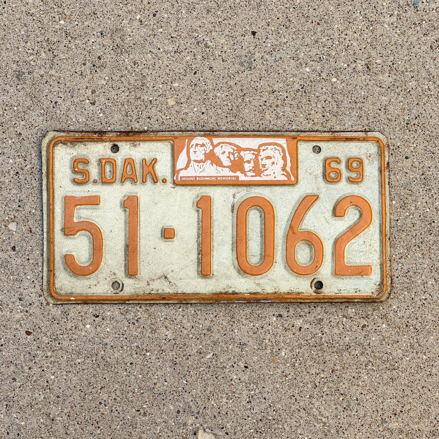 Photo of a 1969 South Dakota License Plate Auto Tag Garage Decor Vintage Mount Rushmore 51 1062 with original patina