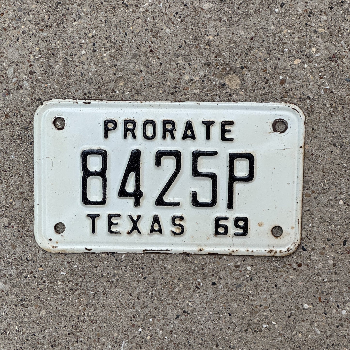 Photo of a 1969 Texas Prorate License Plate Auto Tag Garage Decor Vintage 8425 P with original patina